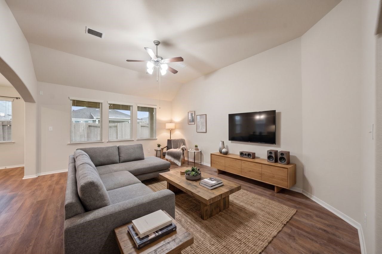 5182 Echo Falls Drive, Alvin, TX 77511 Just an idea of how spacious and naturally lit this living room is!