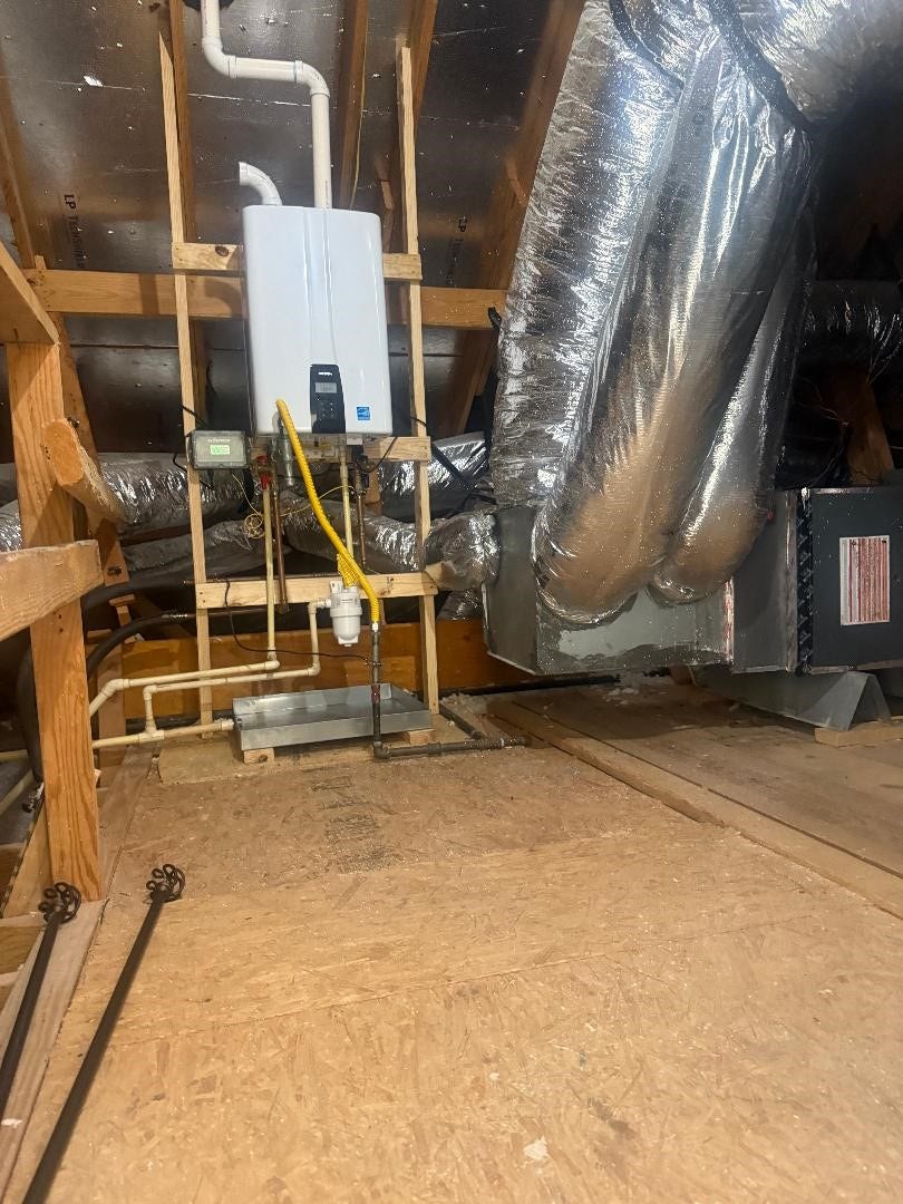 5182 Echo Falls Drive, Alvin, TX 77511 A secondary attic off the game room has also been outfitted as a walk-in and houses a tankless water heater.