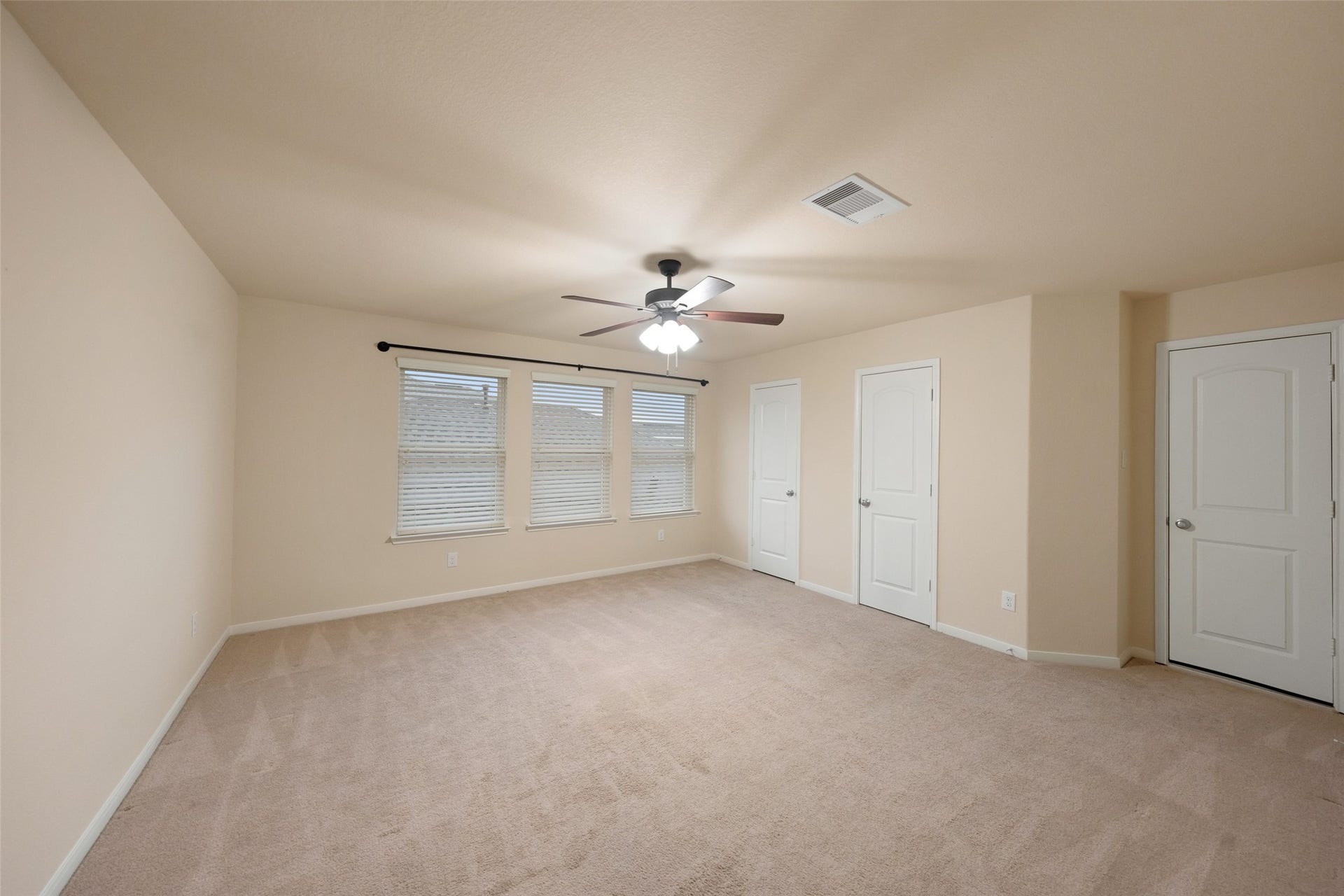 5182 Echo Falls Drive, Alvin, TX 77511 Huge upstairs bedroom. Could easily be a second primary bedroom, with bathroom access just off the hall. Notice the full size door next to the closet. It leads a fully outfitted attic with space galore!
