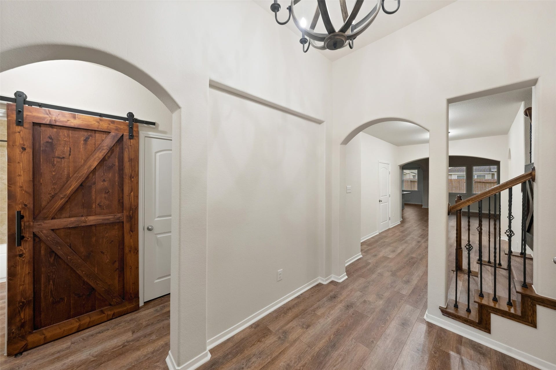 5182 Echo Falls Drive, Alvin, TX 77511 Another view of the foyer showcases the stairs and architectural design that opens up to the living and kitchen.