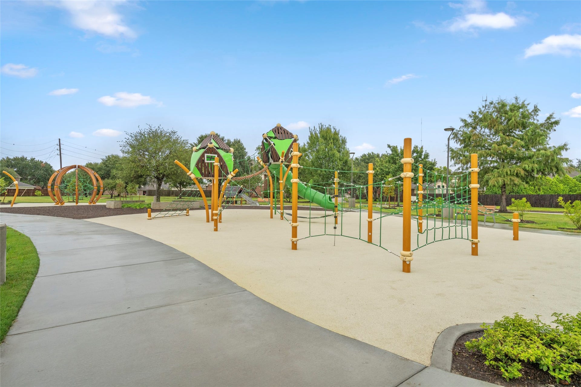 Well-maintained neighborhood playground surrounded by green space, offering a convenient recreational option for families. Community amenities like this can make the difference for buyers looking for more than just the house itself.