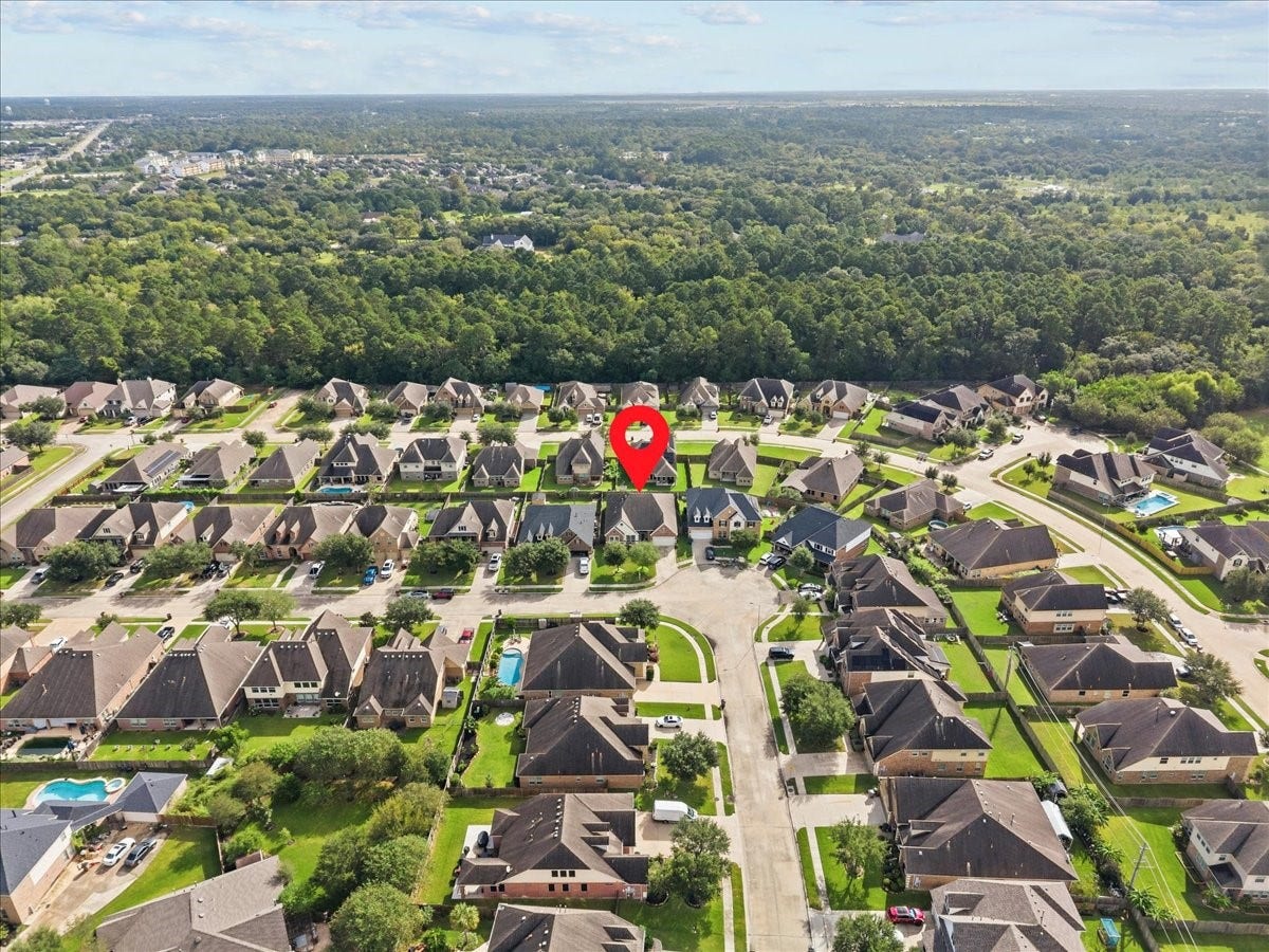 4329 S Meridian Greens Drive, Dickinson, TX 77539 Aerial view showing the neighborhood and surrounding greenery.