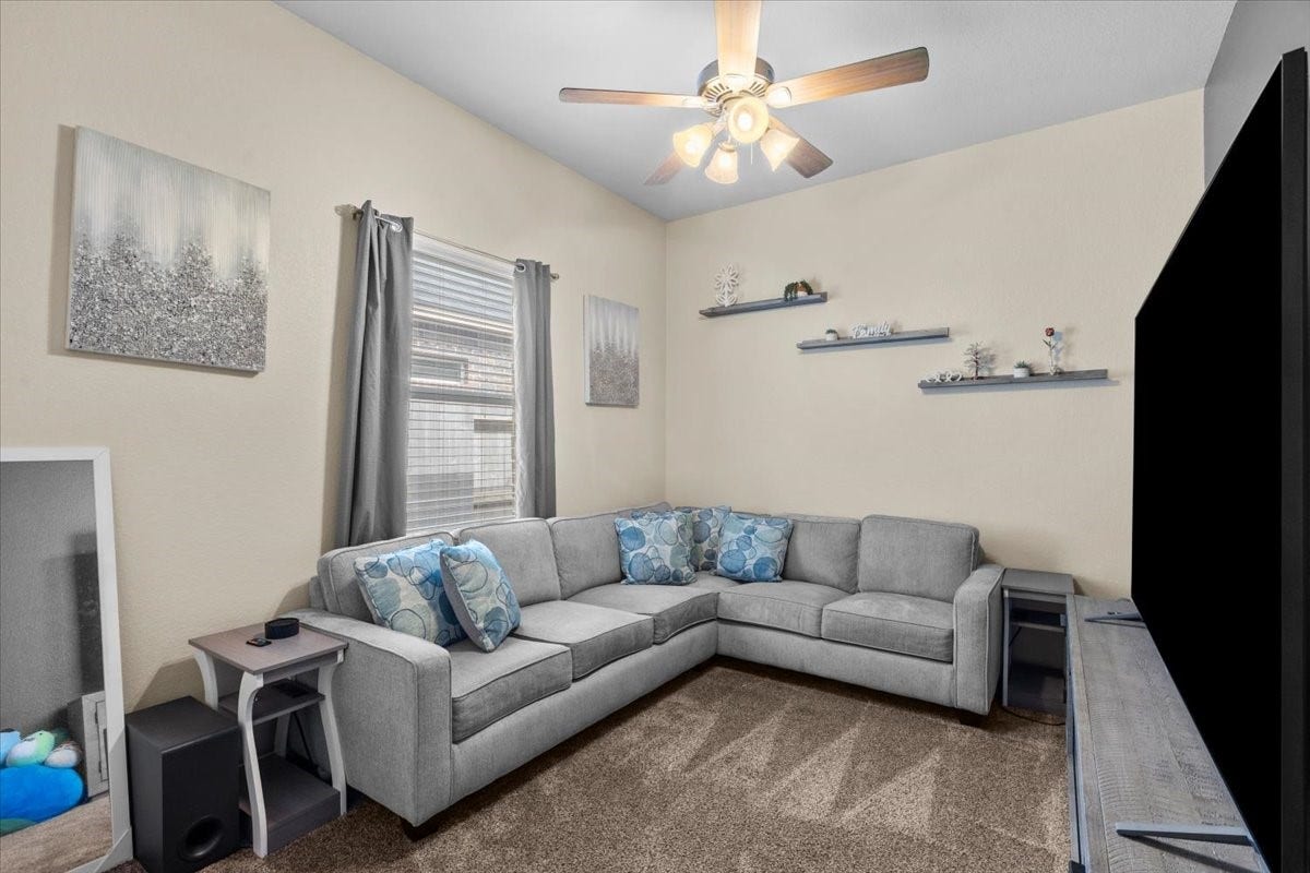 4329 S Meridian Greens Drive, Dickinson, TX 77539 Plenty of space here for a sectional and movie nights.