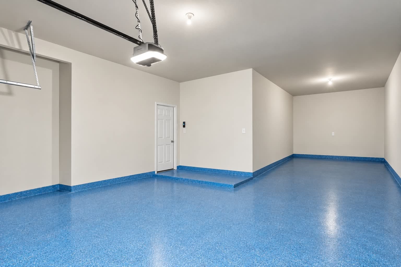 4329 S Meridian Greens Drive, Dickinson, TX 77539 Garage with a coated floor, ready for vehicles, hobbies, or storage.