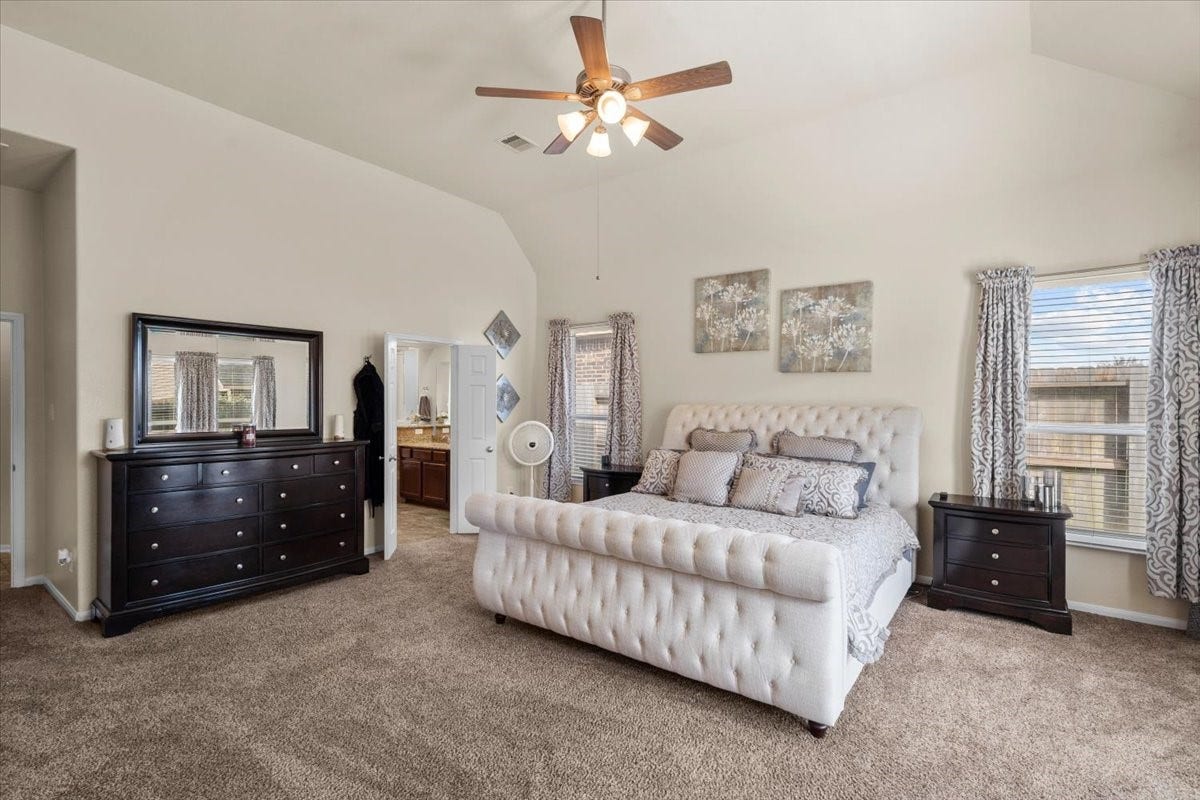 4329 S Meridian Greens Drive, Dickinson, TX 77539 Relaxing primary suite with high ceilings and plenty of natural light.