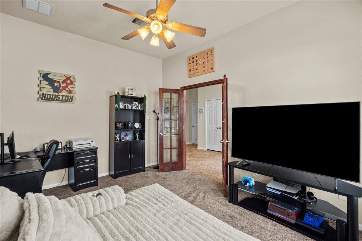 4329 S Meridian Greens Drive, Dickinson, TX 77539 Another view of the flex room with space for both work and relaxing.