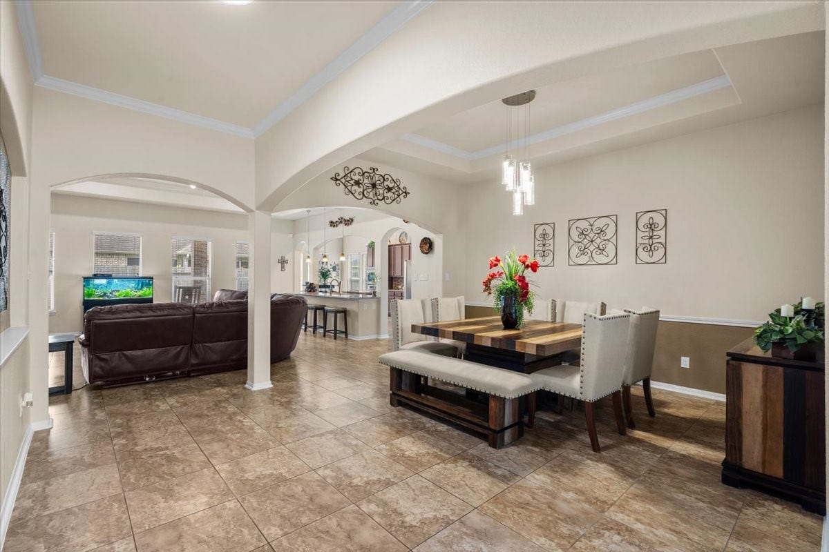 4329 S Meridian Greens Drive, Dickinson, TX 77539 Dining room flows openly toward the main living areas, ideal for entertaining.