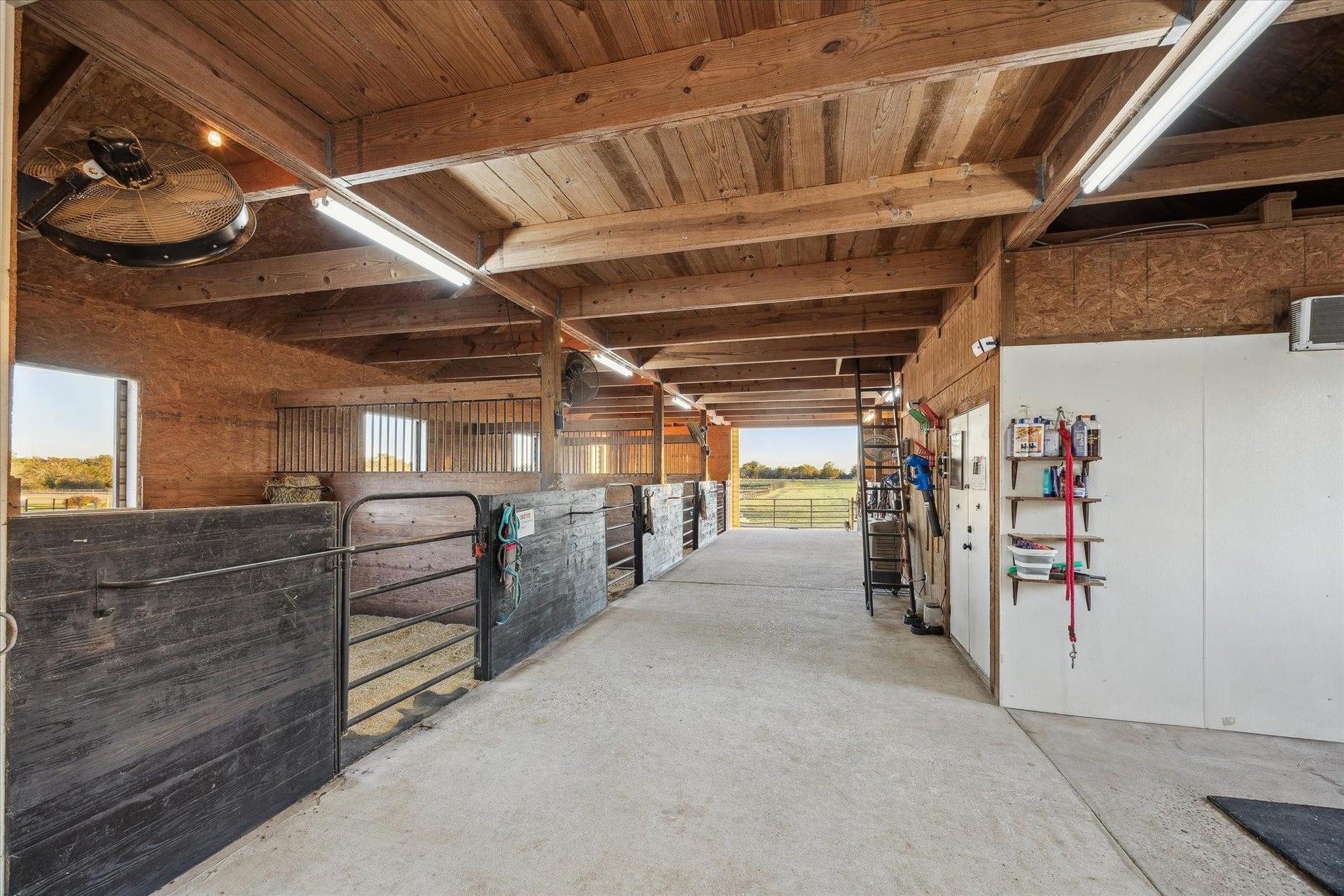 This well-maintained barn offers multiple stalls sliding gates, and ample ventilation. Wide aisles and organized storage make daily chores a breeze perfect for any equestrian lifestyle.