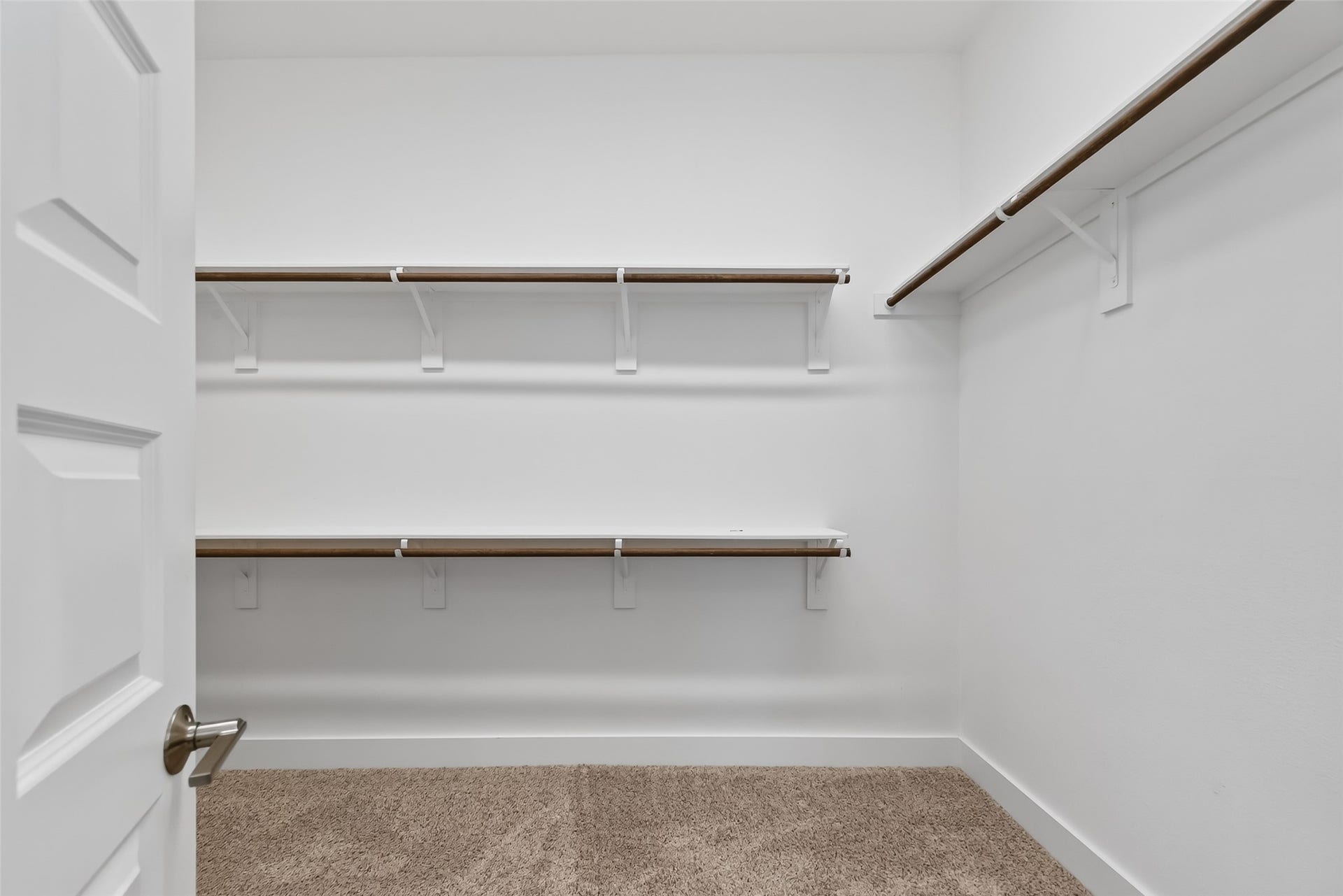 3415 Mckinney Ridge Drive, Houston, TX 77059 Spacious walk-in closet off of the primary bath with multiple shelves and hanging rods.