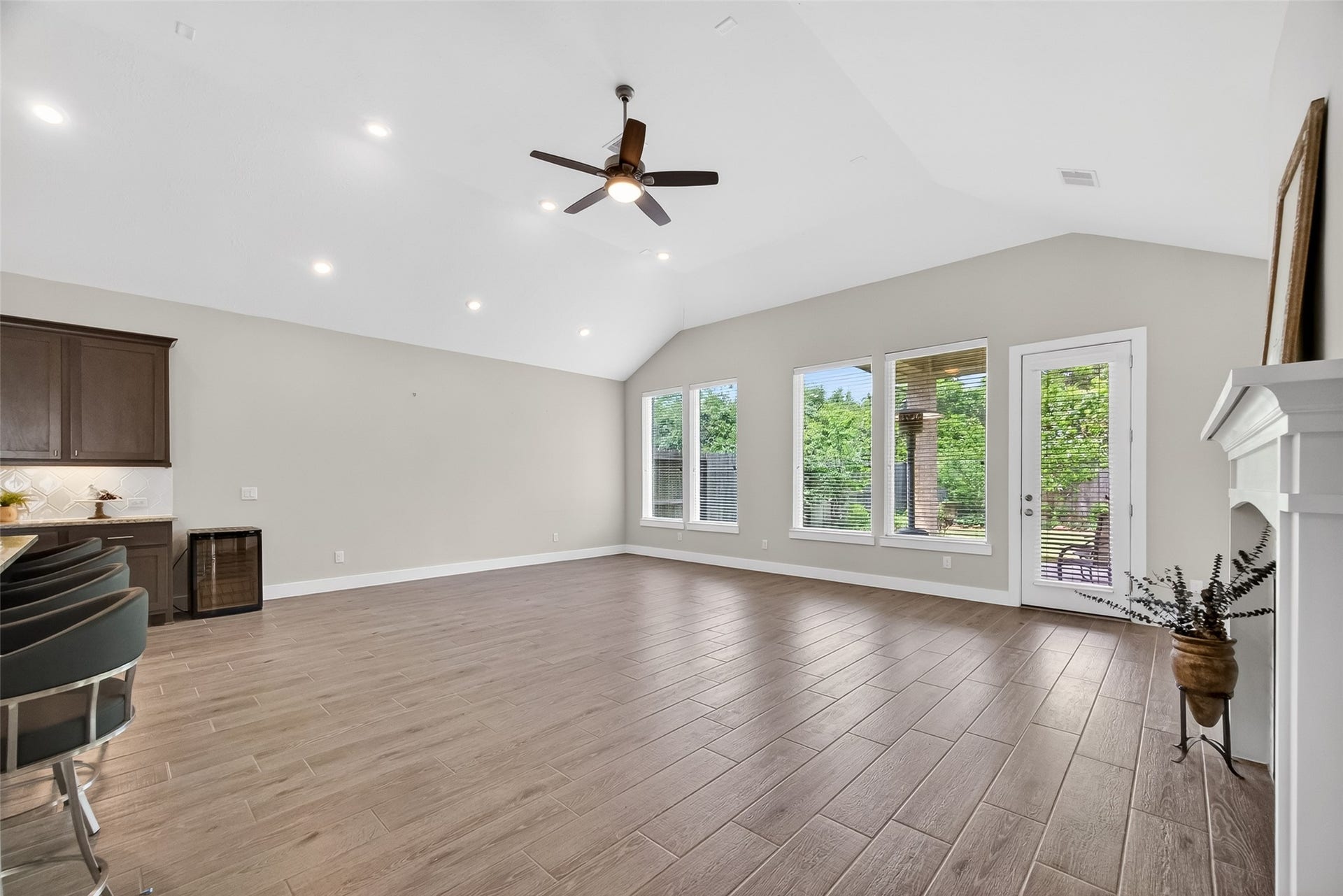 3415 Mckinney Ridge Drive, Houston, TX 77059 Wall of windows provide a great view of the backyard patio and gardens.