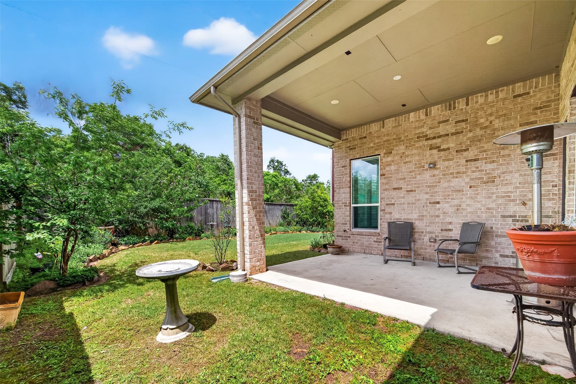 3415 Mckinney Ridge Drive, Houston, TX 77059 Backyard patio with two chairs.