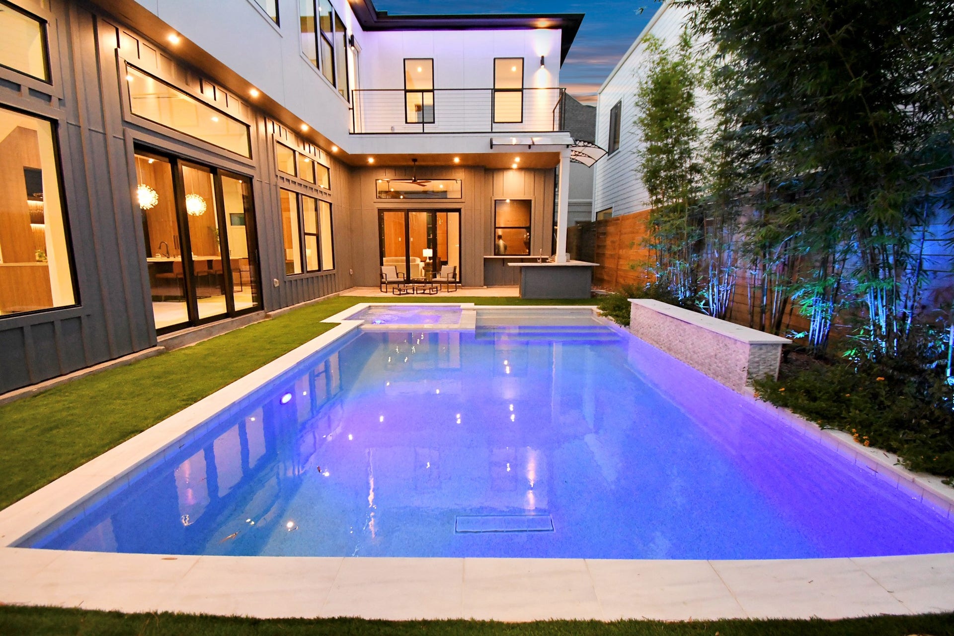 5414 John Dreaper Drive, Houston, TX 77056 Exterior home has lighting throughout featuring LED lighting, soffit canned lights, and pool lighting.