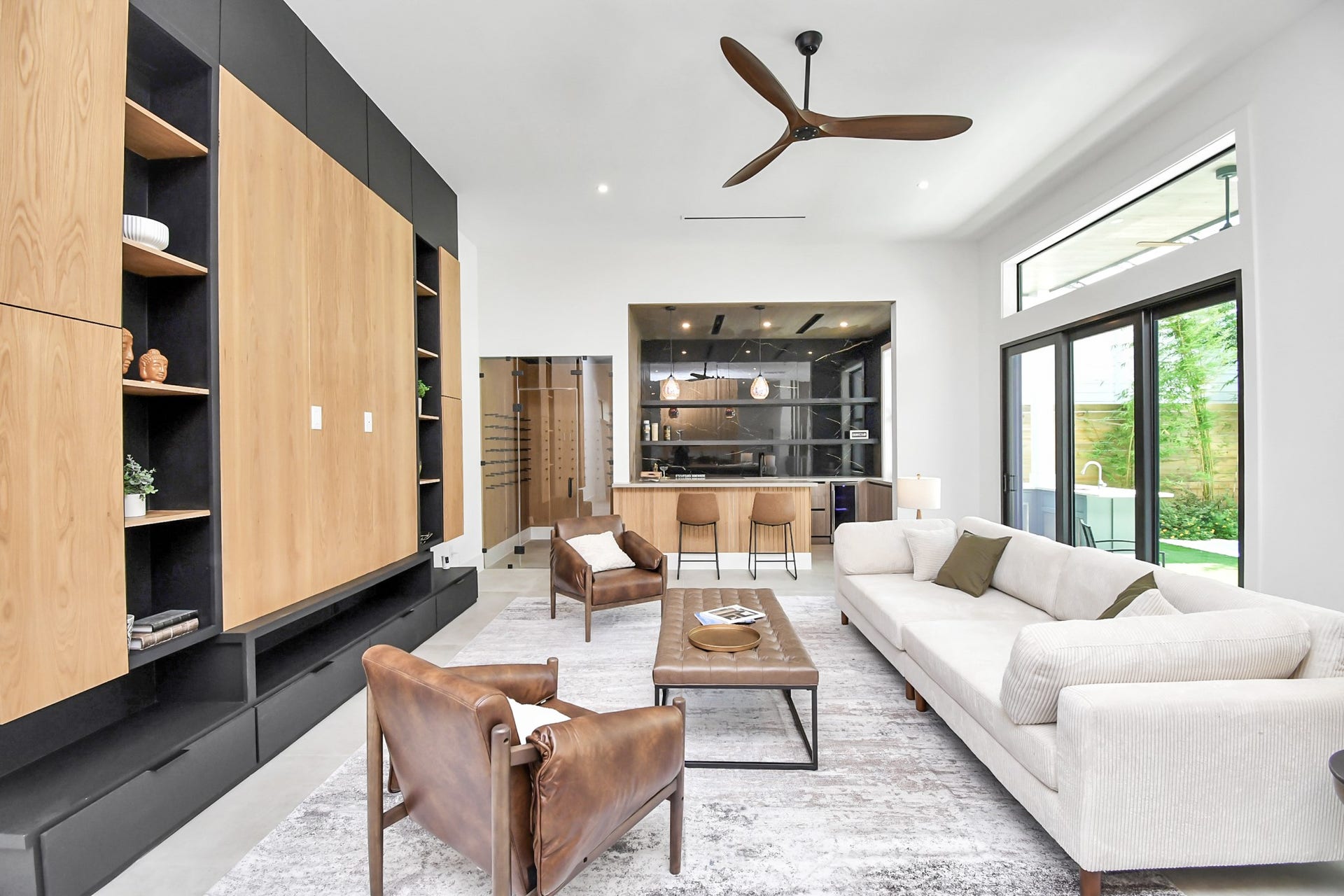 5414 John Dreaper Drive, Houston, TX 77056 Living room features sliding doors with easy access to the side yard with pool.