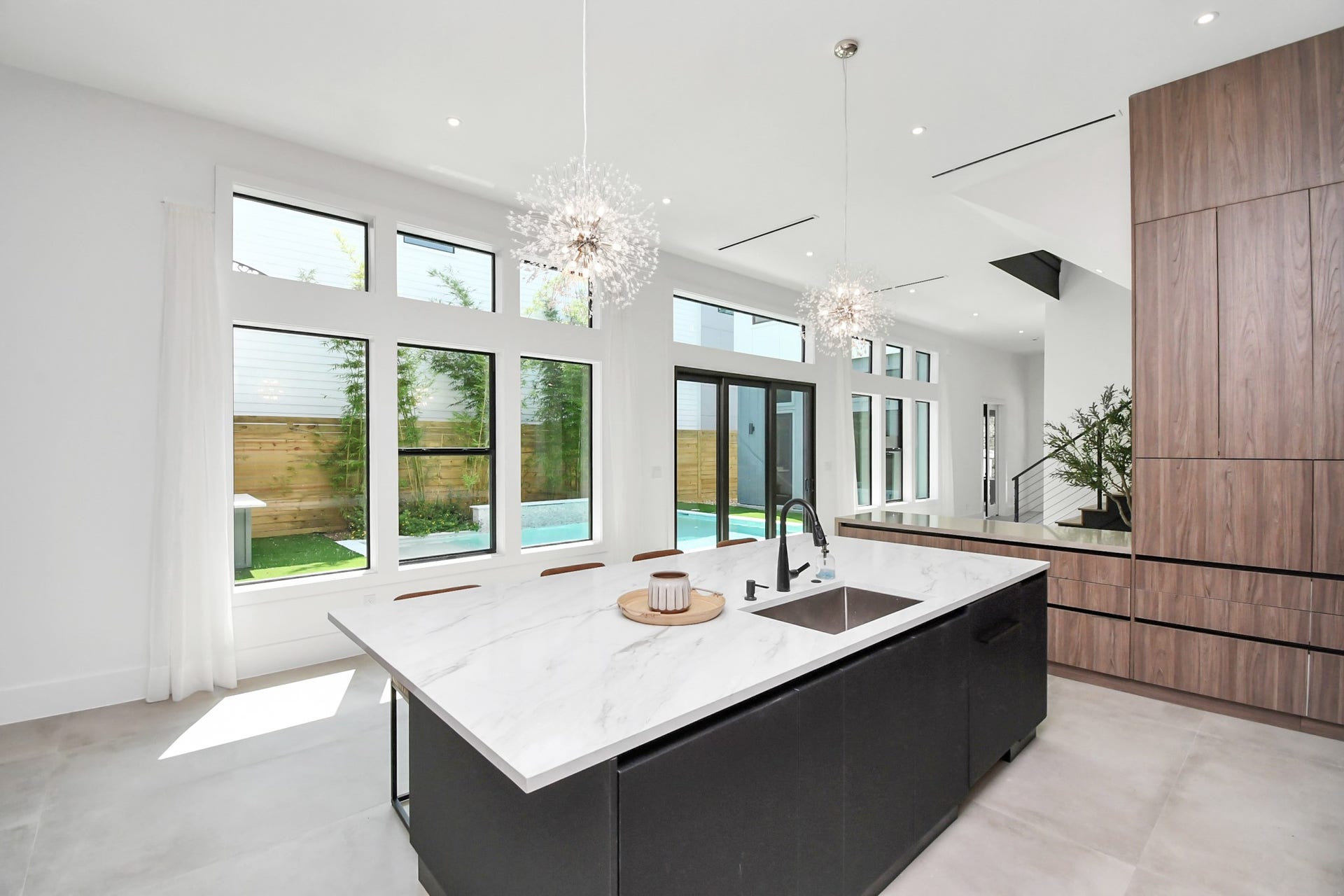 5414 John Dreaper Drive, Houston, TX 77056 Kitchen overlooks like the side yard pool with sliding doors to welcome the natural light.