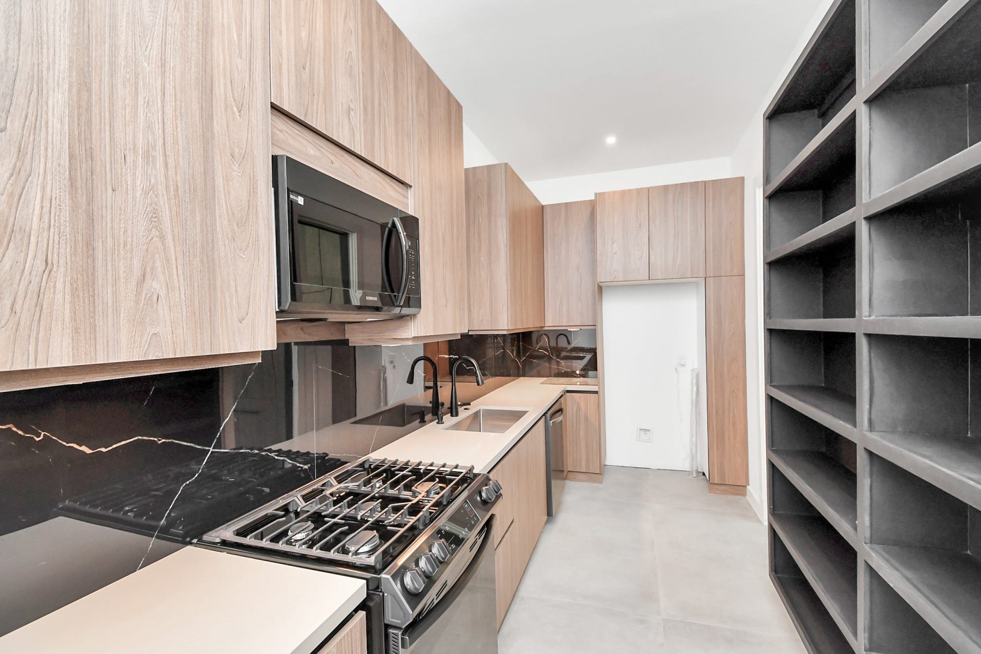 5414 John Dreaper Drive, Houston, TX 77056 Additional full working kitchen behind the main kitchen with gas range, microwave, sink, and dishwasher.