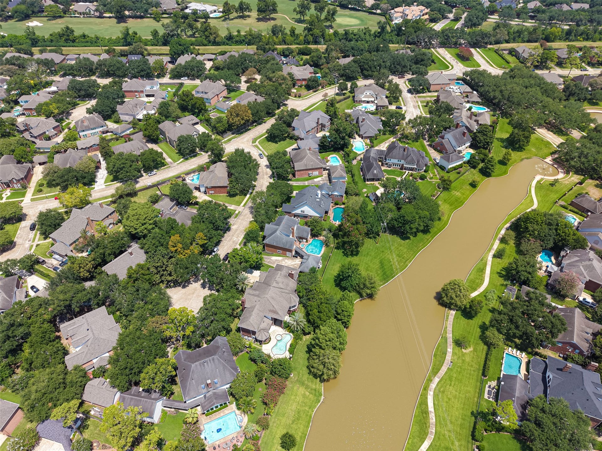 18 Tredington Street, Sugar Land, TX 77479 Nestled in a picturesque neighborhood, this stunning property offers lake views and lush greenery, creating a peaceful oasis in a vibrant community. Perfect for those seeking a blend of nature and modern living.