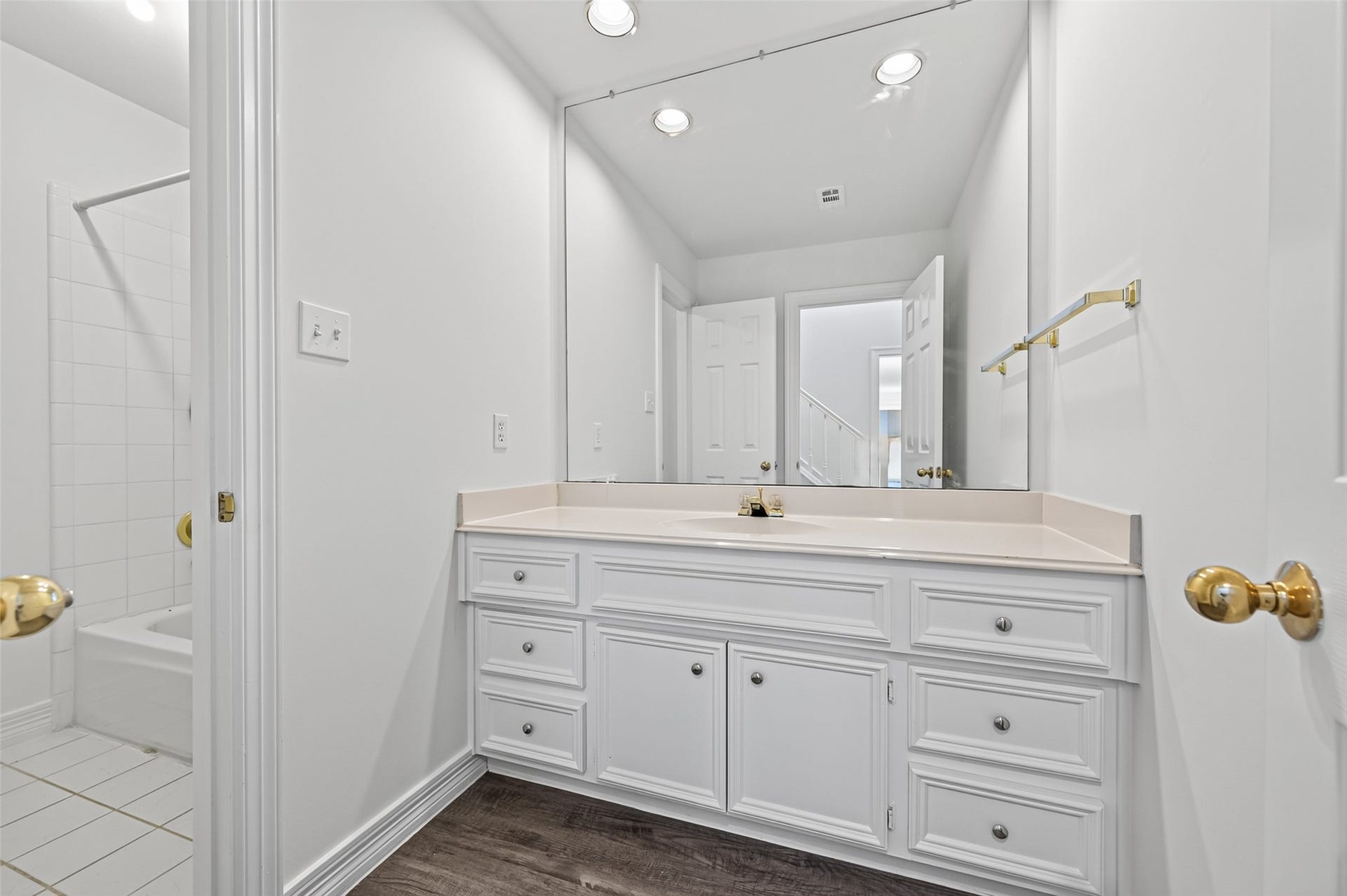18 Tredington Street, Sugar Land, TX 77479 Bright and spacious bathroom featuring a large vanity, and a wide mirror.