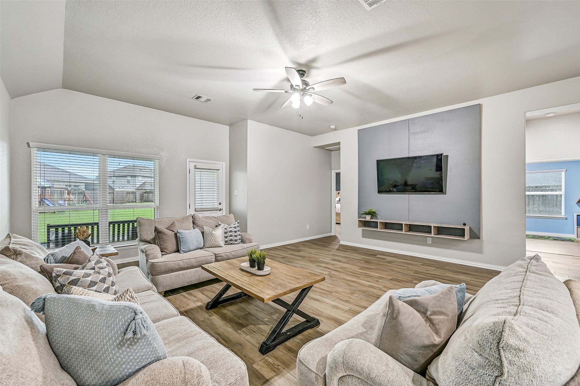 From this angle, you can truly appreciate the home's seamless flow from the entry through the dining room and into the kitchen and living spaces. The continuous flooring and neutral palette create a cohesive, move-in-ready interior.