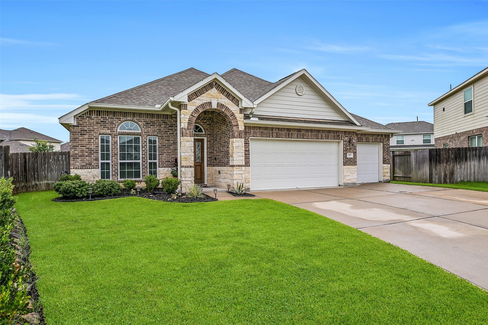 Welcome home to this attractive one-story Anglia home, where fresh landscaping, a handsome brick and stone elevation, and an inviting arched entry create wonderful curb appeal. Situated on a spacious cul-de-sac lot in Martha's Vineyard, this home also offers an attached 3-car garage.
