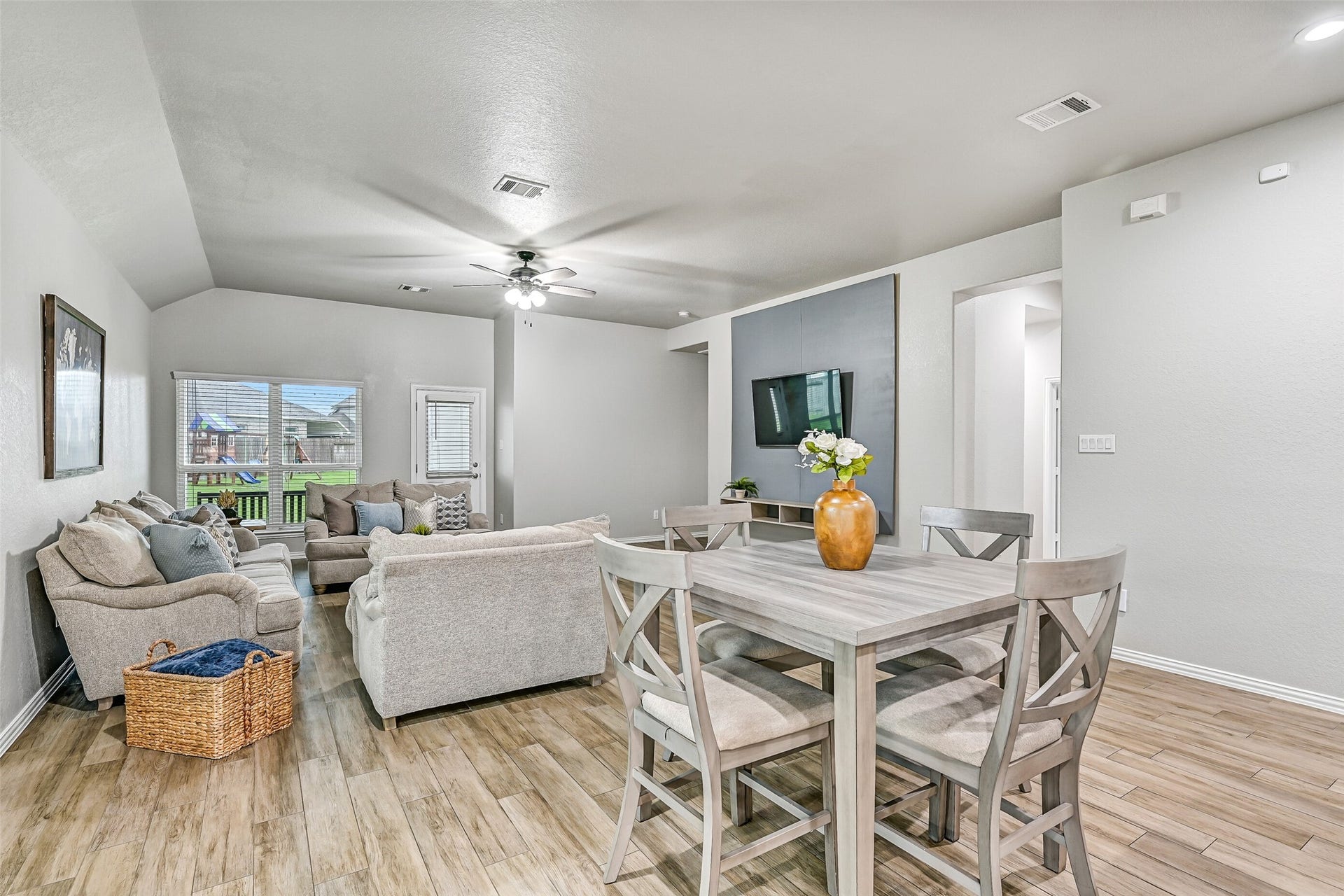 From the kitchen, the open floor plan unfolds into the breakfast room and spacious family room, creating one large gathering space where conversations flow easily and everyone can stay connected.