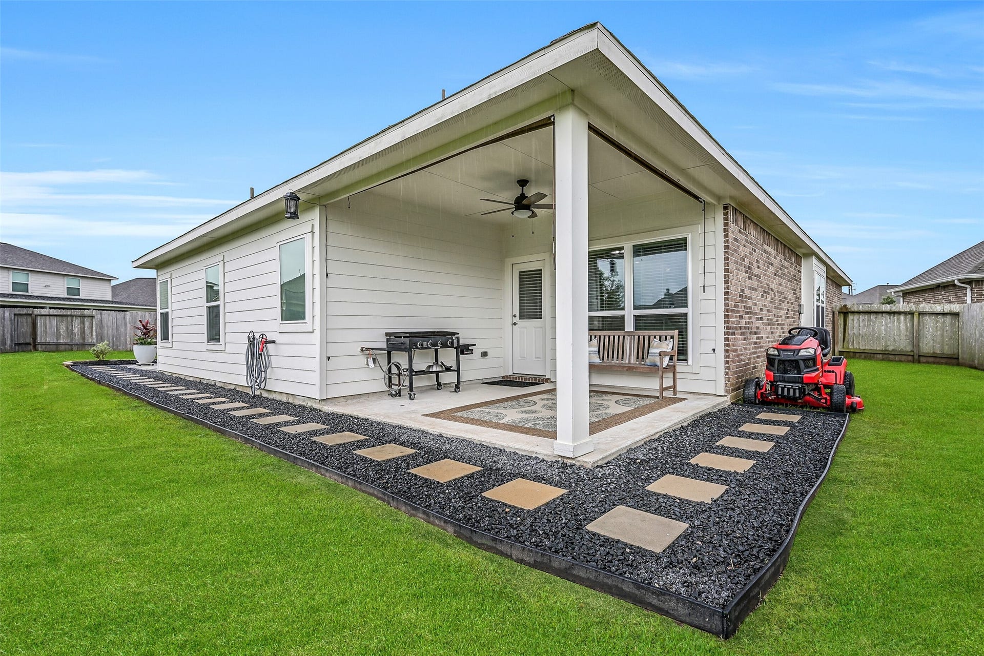 Step outside to discover a backyard that's truly hard to find in this price range. The covered patio is complemented by attractive landscaping, stepping stone walkways, gutters, and plenty of room for grilling, relaxing, and entertaining family and friends.