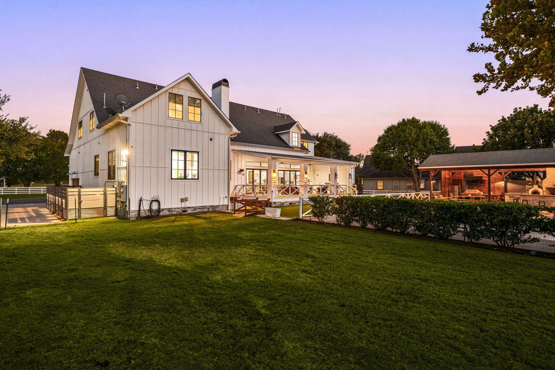 6571 Manorwood Drive, Katy, TX 77493 An expansive green lawn meets an incredible pool, outdoor kitchen and covered patioperfect for Texas-sized entertaining.