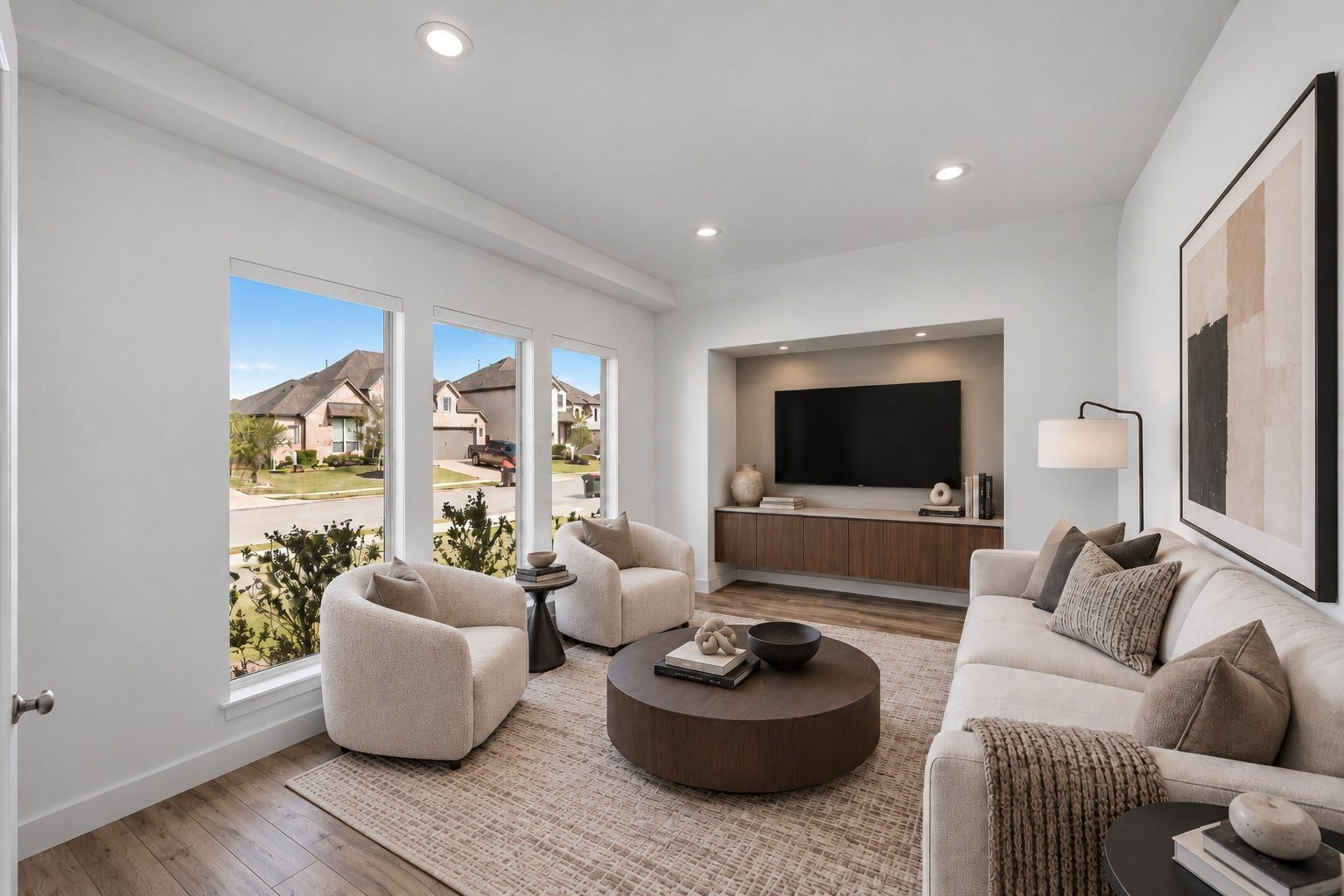 24919 Hibiscus Garden Way, Katy, TX 77493 Virtually Staged: Generous proportions and continuous natural light from expansive vertical windows create a comfortable, seamless gathering space