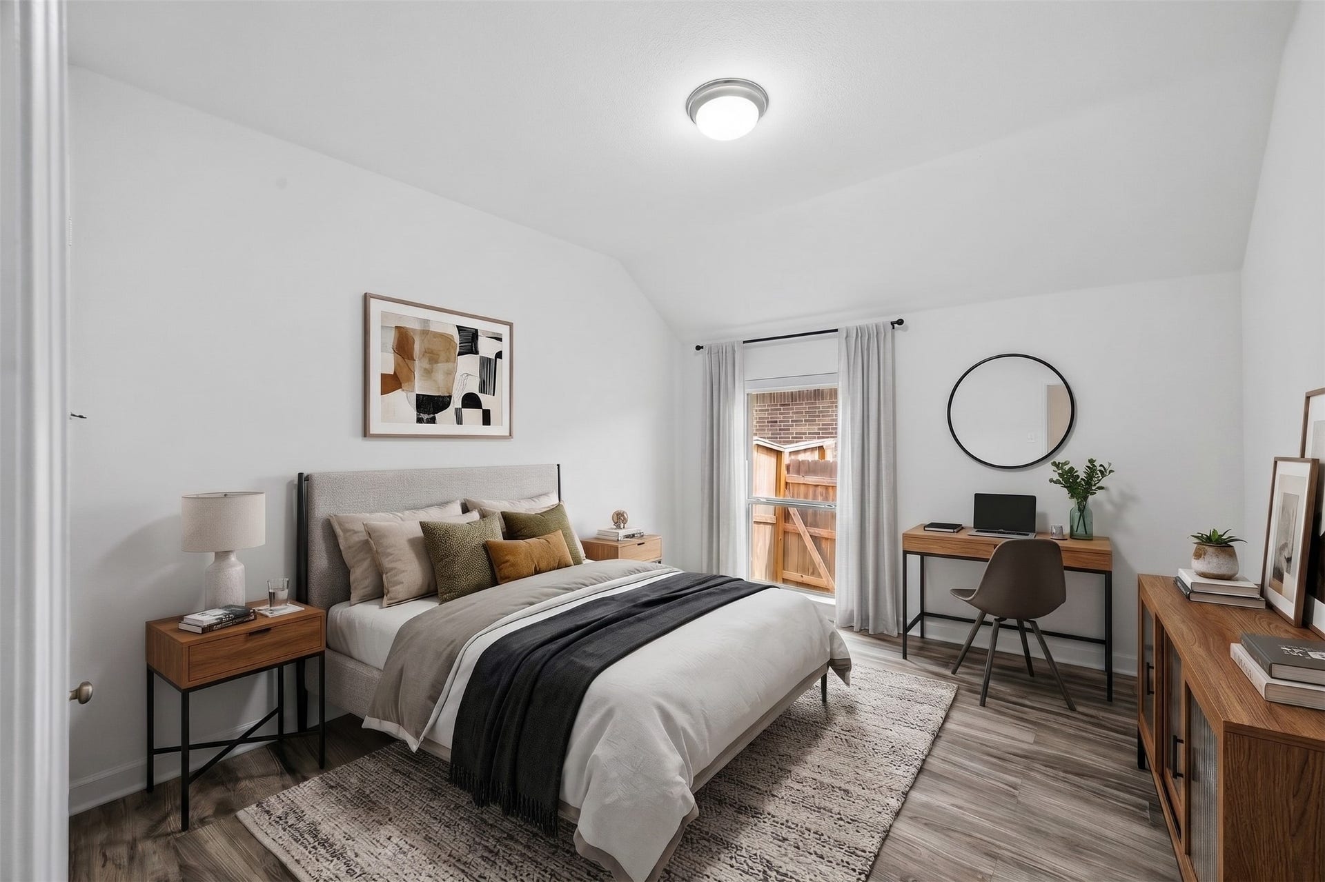 24919 Hibiscus Garden Way, Katy, TX 77493 Virtually Staged: This bright contemporary bedroom features soaring vaulted ceilings and low-maintenance wood-style flooring. The open layout effortlessly accommodates a complete bed set, accent storage.