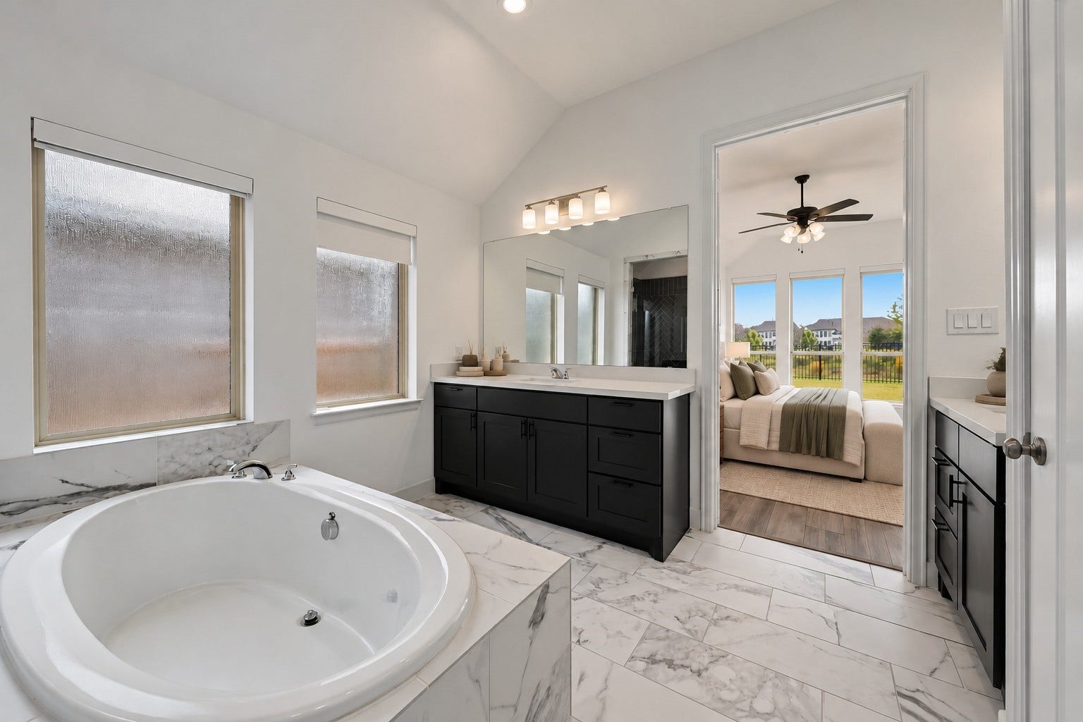 24919 Hibiscus Garden Way, Katy, TX 77493 Virtually Staged: Featuring textured glass windows and continuous tile flooring, this layout effortlessly connects solid-surface vanity prep spaces with the adjoining retreat.