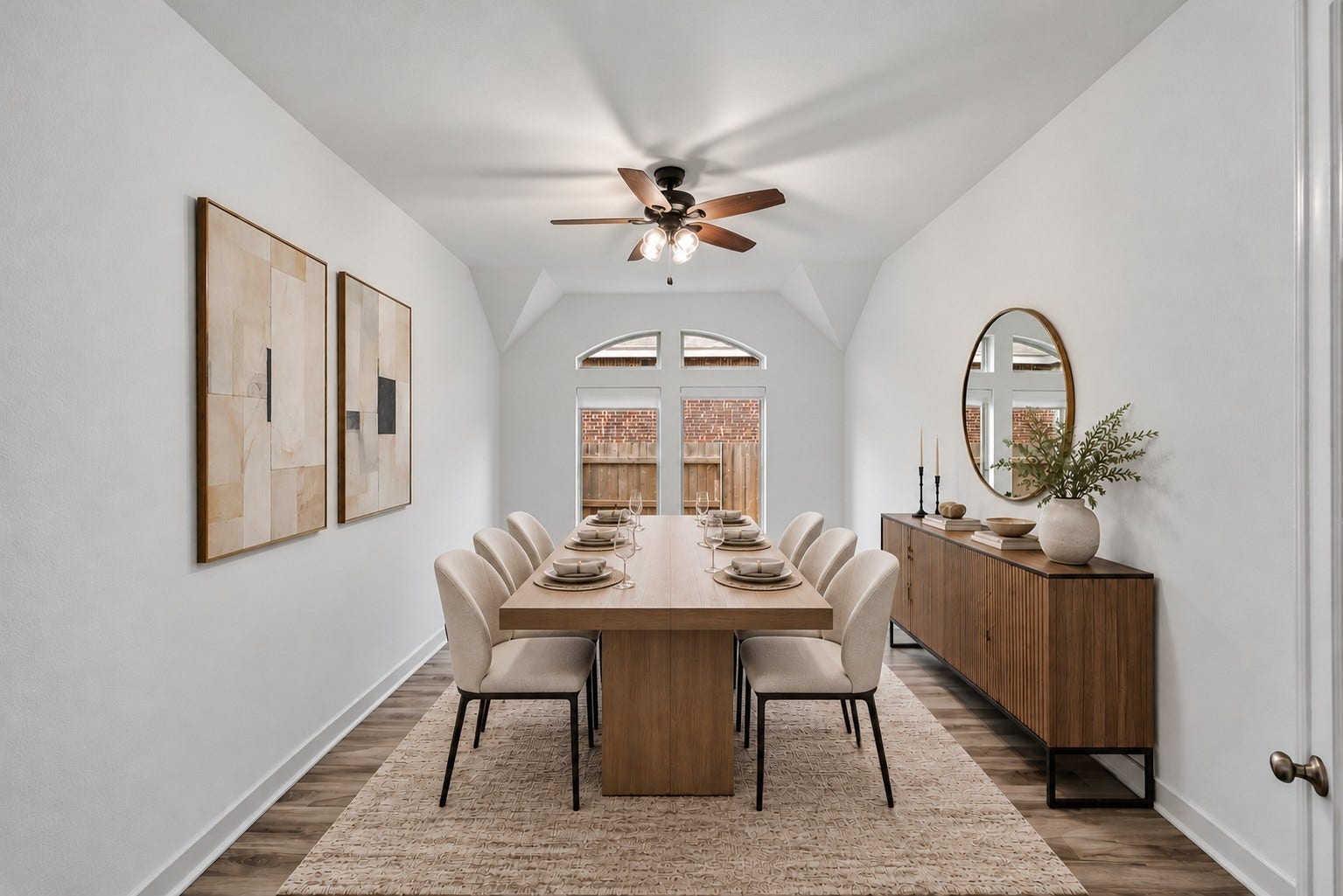 24919 Hibiscus Garden Way, Katy, TX 77493 Virtually Staged: Welcome to an inviting formal dining room where dramatic cathedral ceilings and arched transom windows create an immediate impression of height and openness.