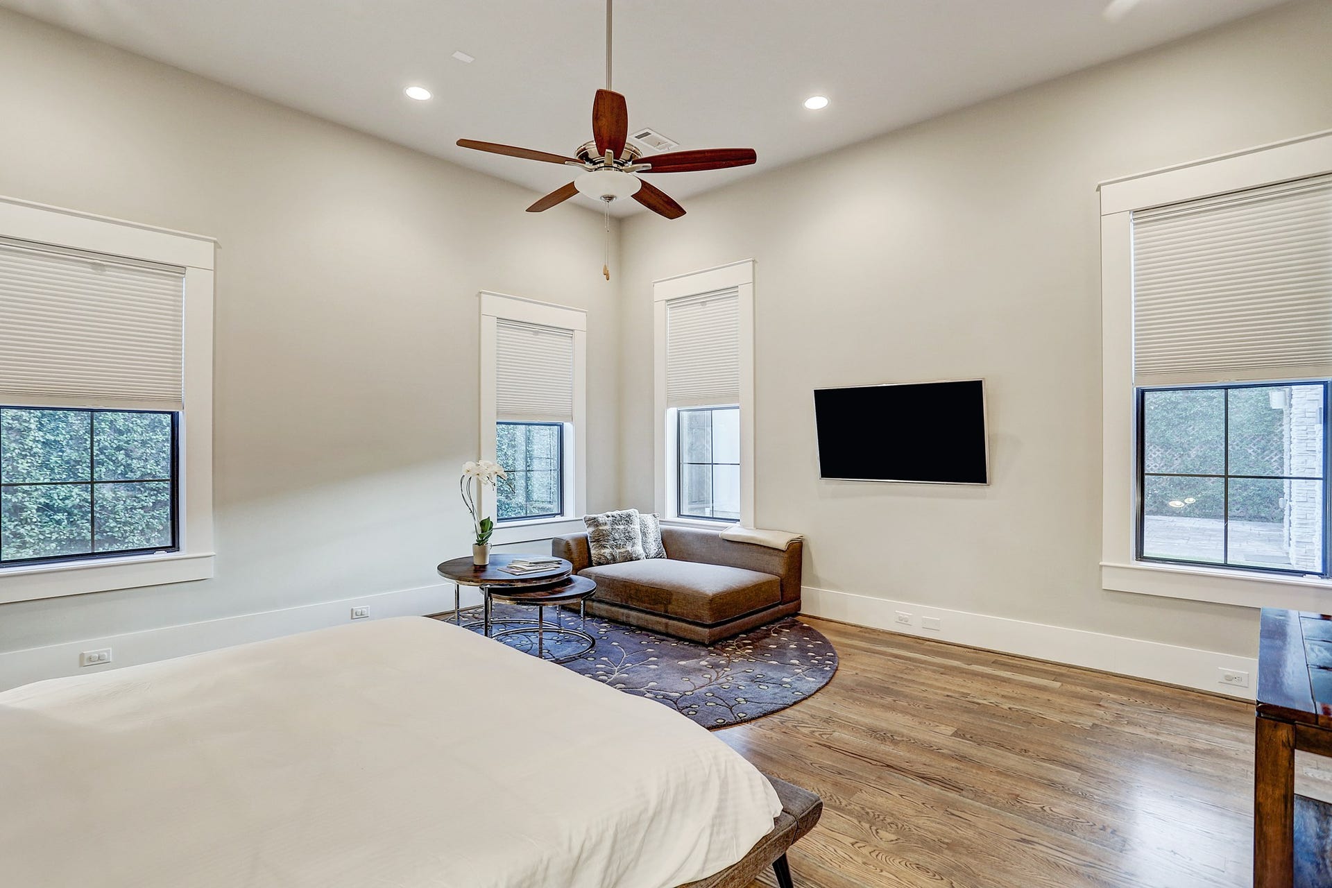 First floor master bedroom has light filtering adjustable window shades, which are found throughout the house.
