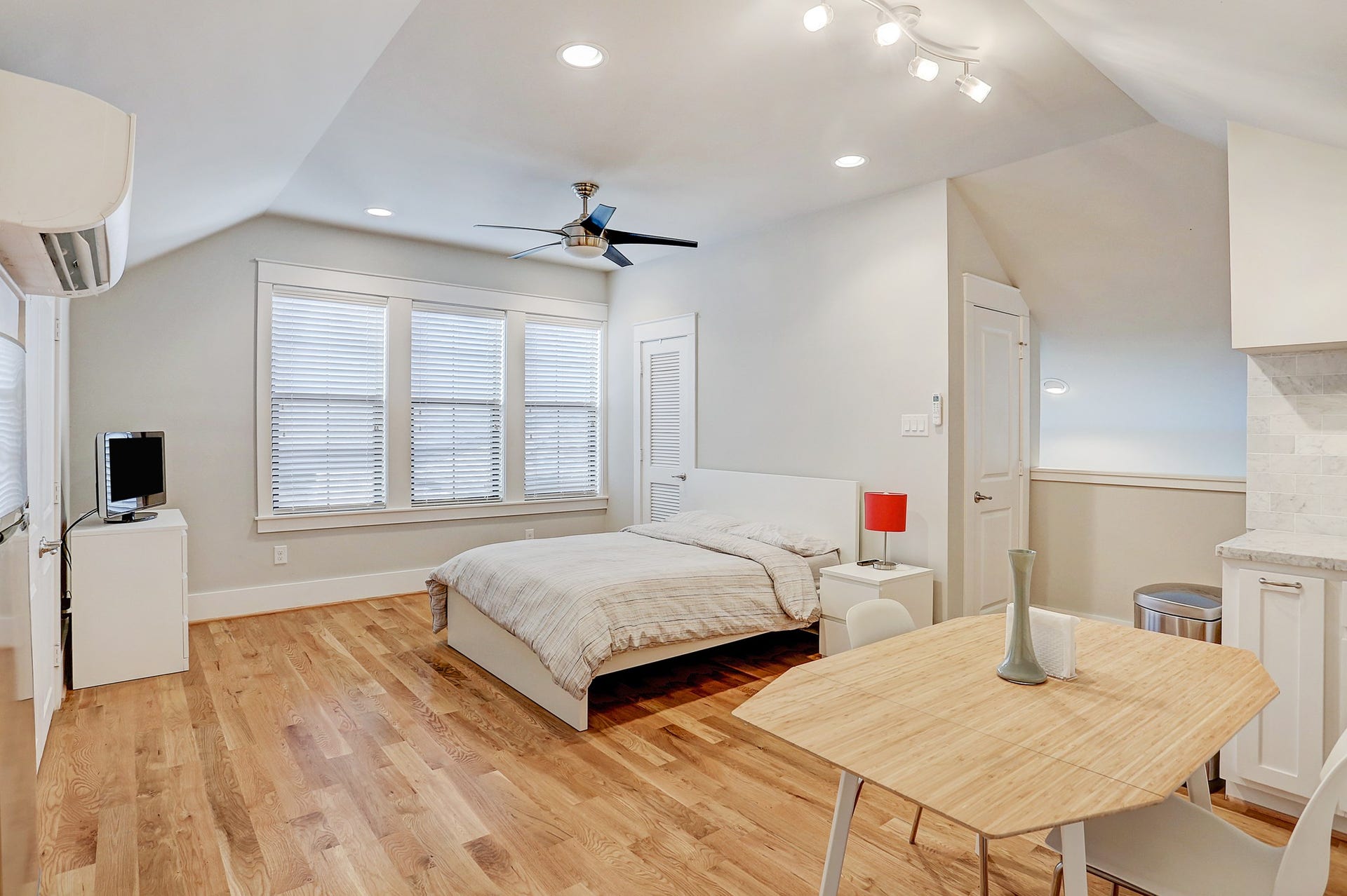 Guest Quarters / Garage Apt has hardwood floor, ceiling fan with light kit, recessed lighting, and Daikin AC unit.
