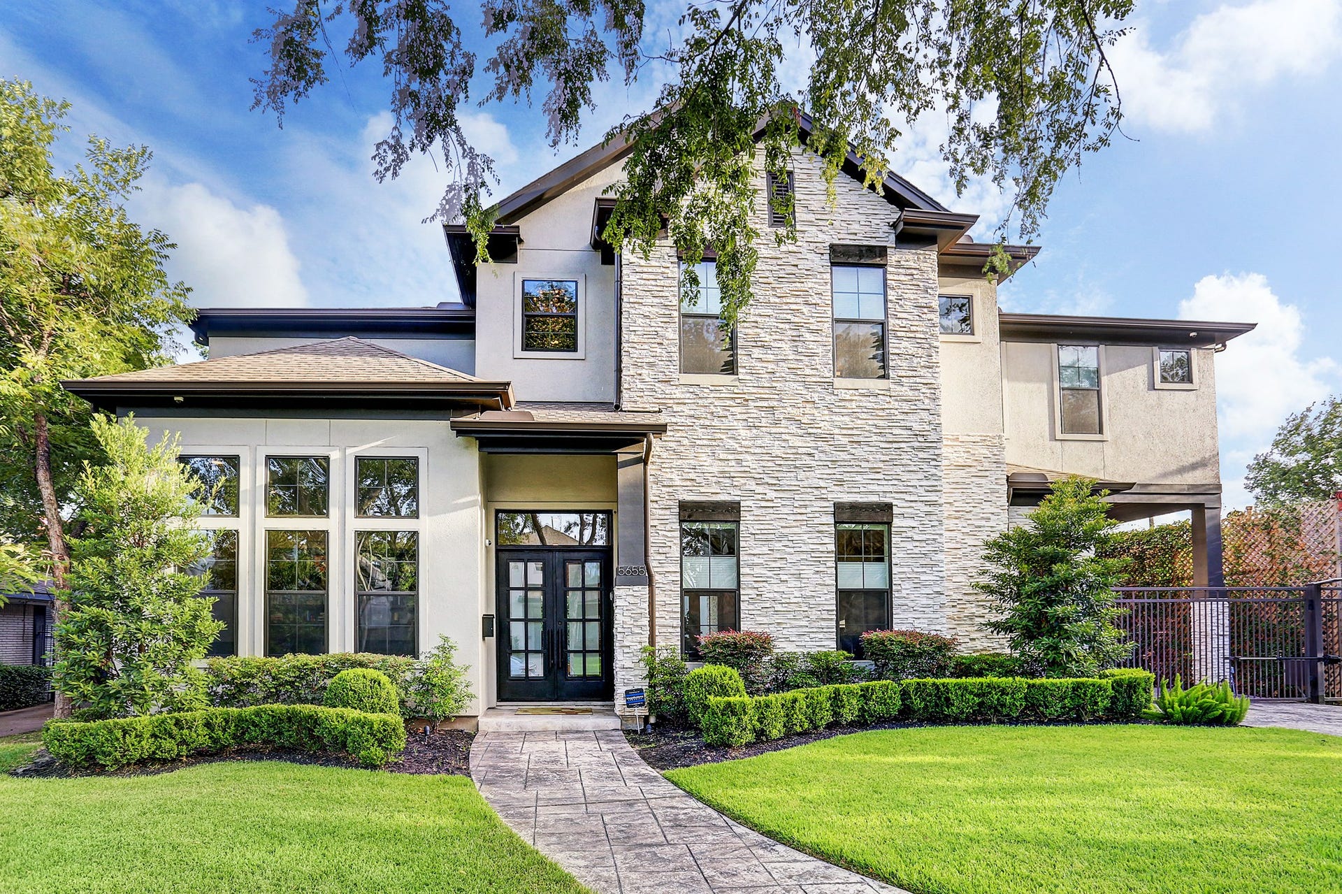 5655 Locke Ln is a 4,582 SF stacked stone and stucco home in Briarcroft.  Square footage is 4,054 in main house and 528 in guest quarters / garage apt.