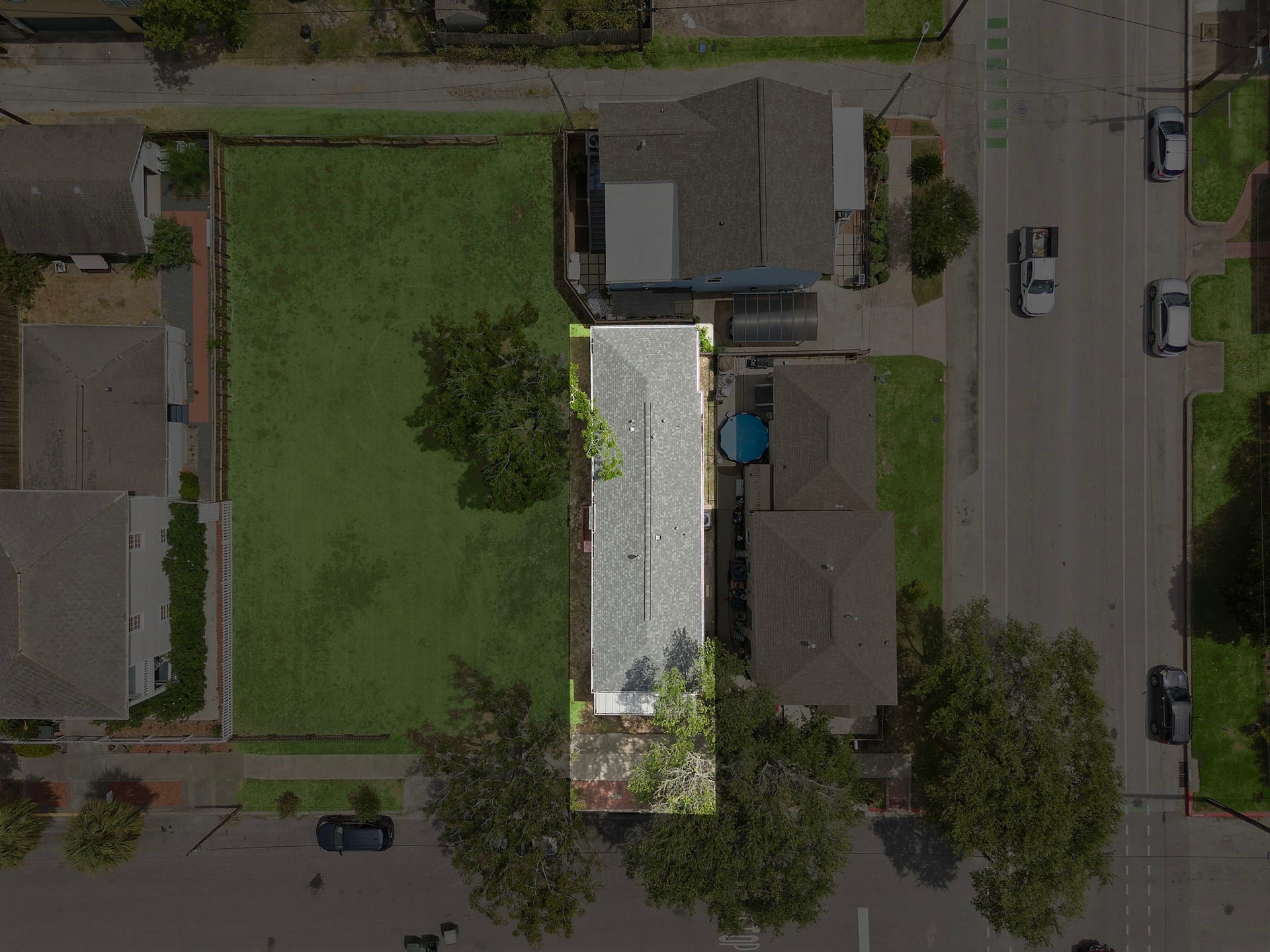 1825 Avenue N Street, Galveston, TX 77550 View of home and surrounding homes and lot.