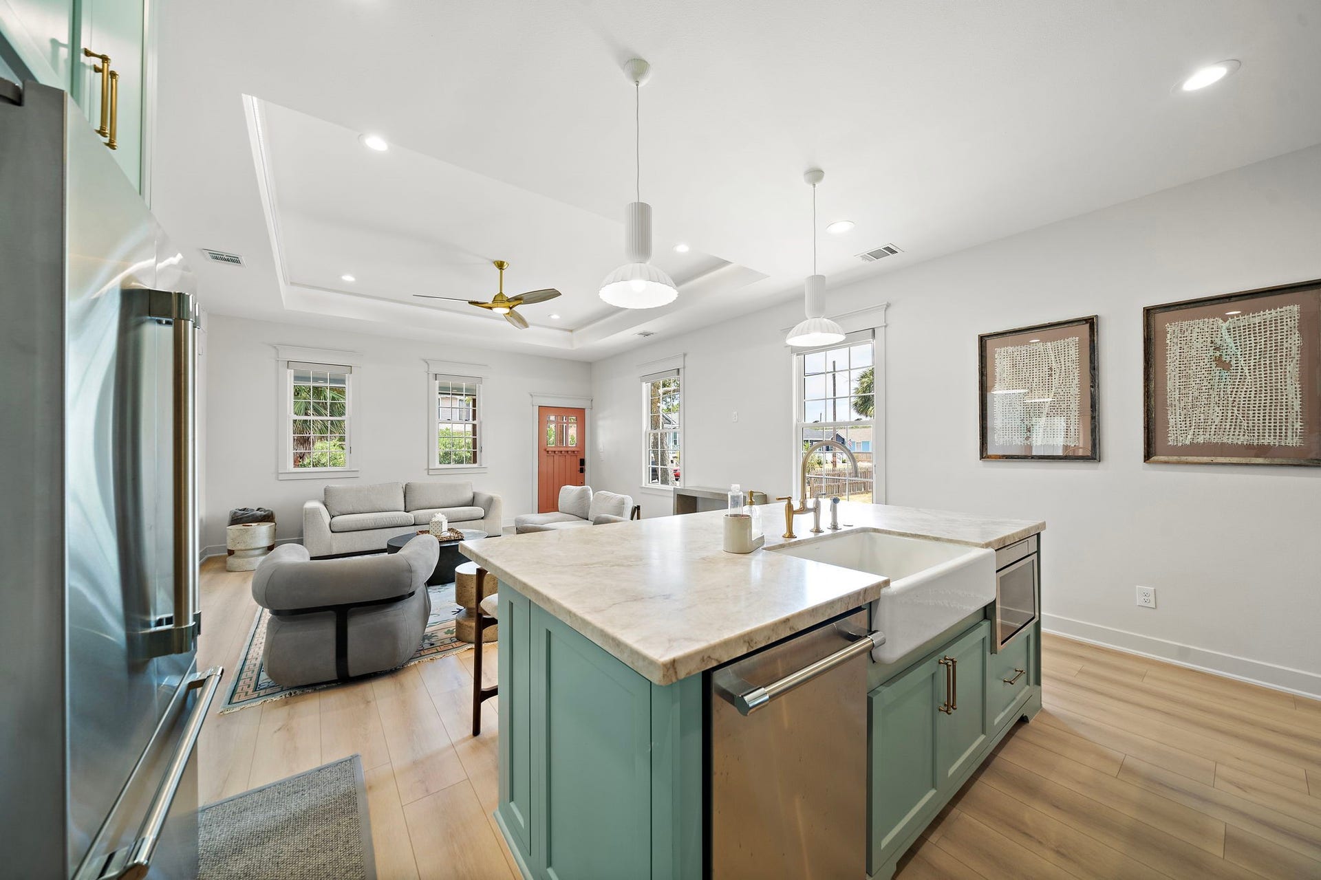 1825 Avenue N Street, Galveston, TX 77550 Kitchen island with dishwasher, microwave, Quartzite leathered countertop, extra storage and farmhouse sink.