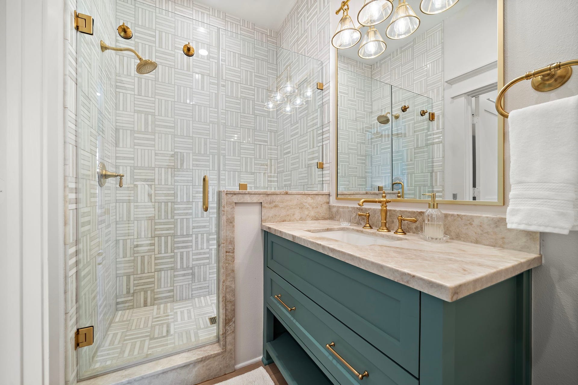 1825 Avenue N Street, Galveston, TX 77550 Bathroom with gorgeous finishes including walk-in shower, quartzite countertops, and brass Kohler fixtures.