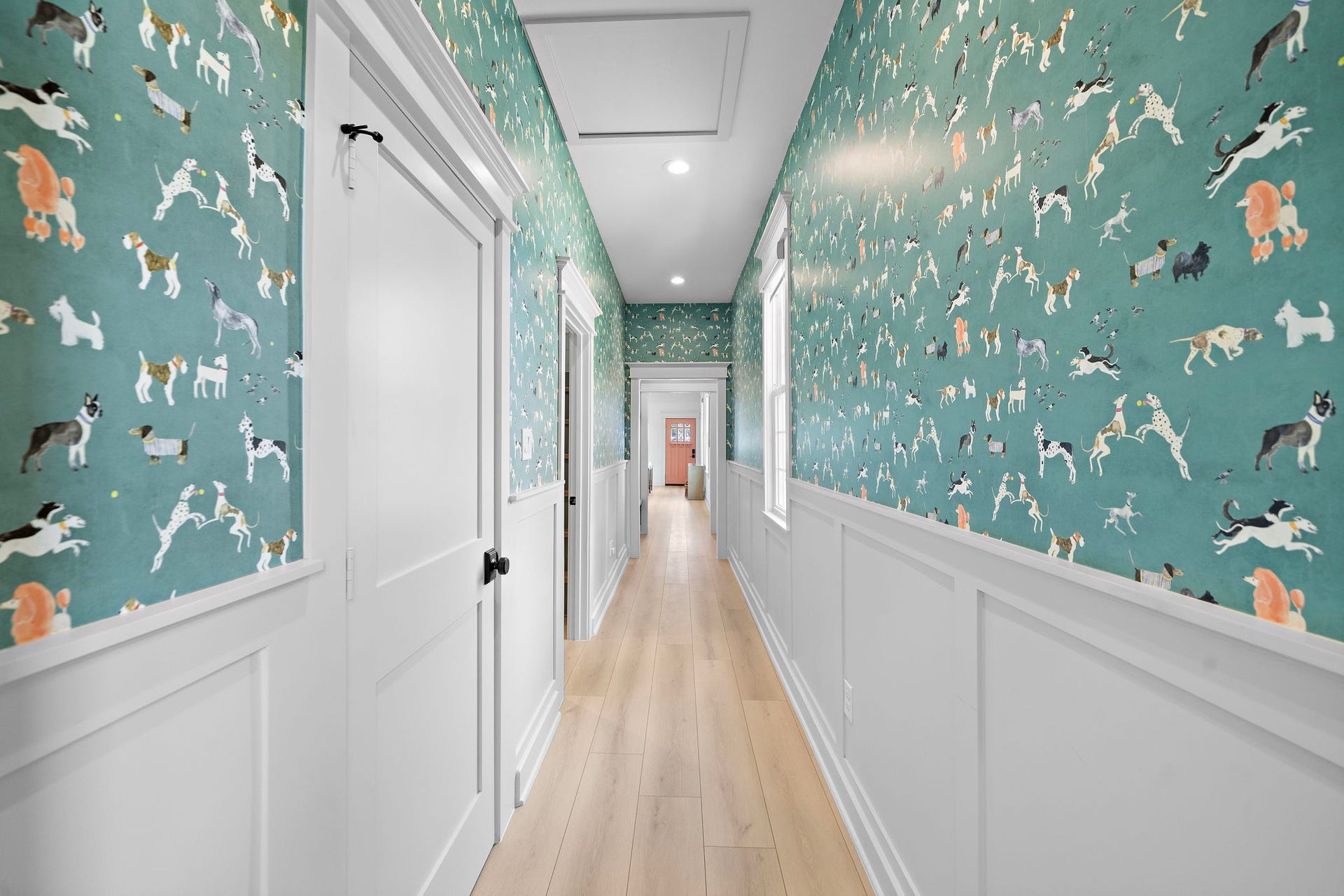 1825 Avenue N Street, Galveston, TX 77550 Designer wallpaper in the long hall leading to the two bedrooms and laundry with built-ins.