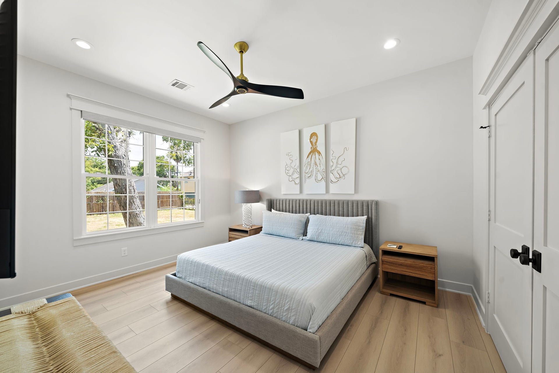 1825 Avenue N Street, Galveston, TX 77550 View of the spacious primary bedroom at the back of the home. Includes black out custom blinds and built-ins within closet.