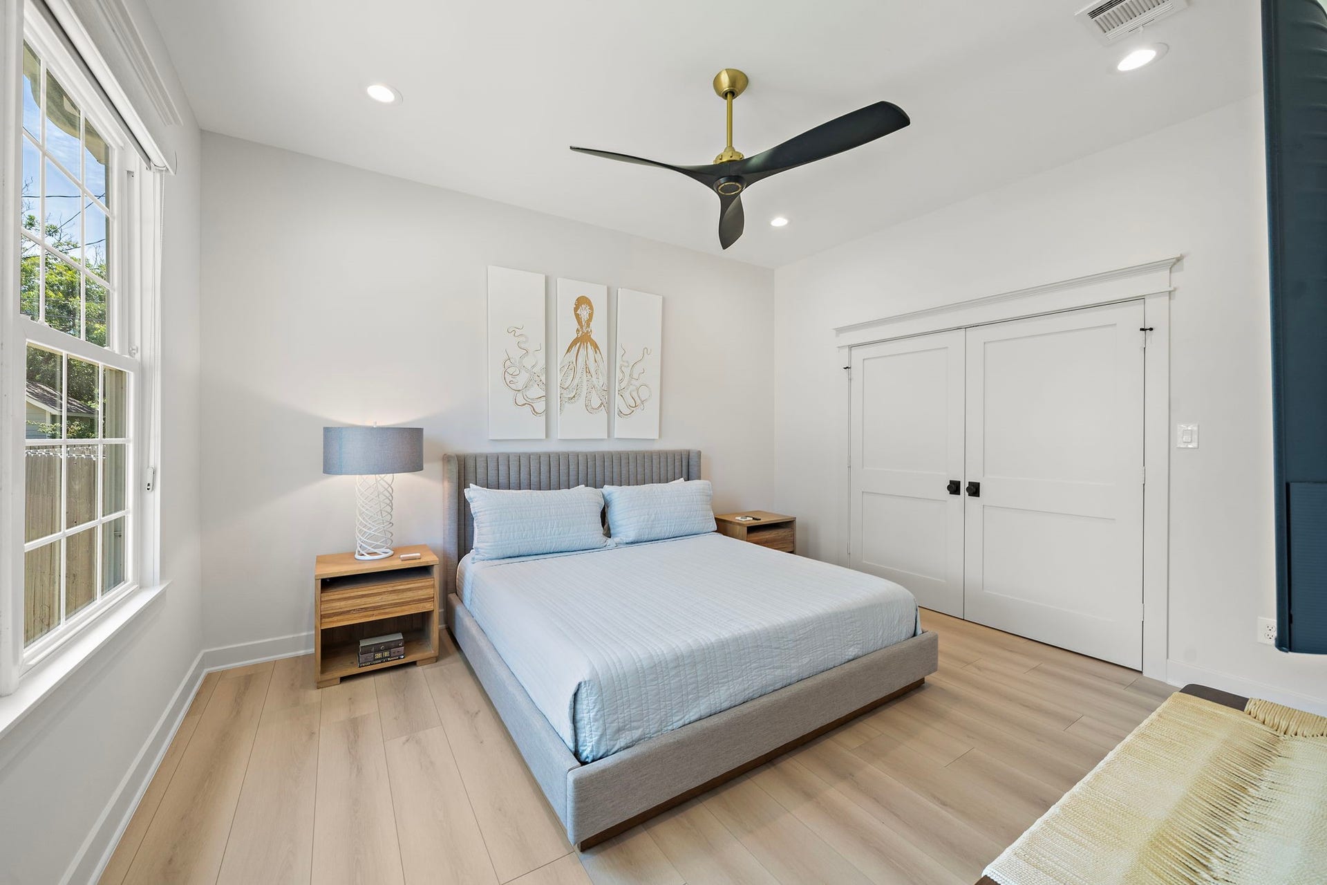 1825 Avenue N Street, Galveston, TX 77550 Primary bedroom with recessed lighting, Miele ceiling fan, closet with built-ins, custom black out shades, and ensuite bathroom with shower.