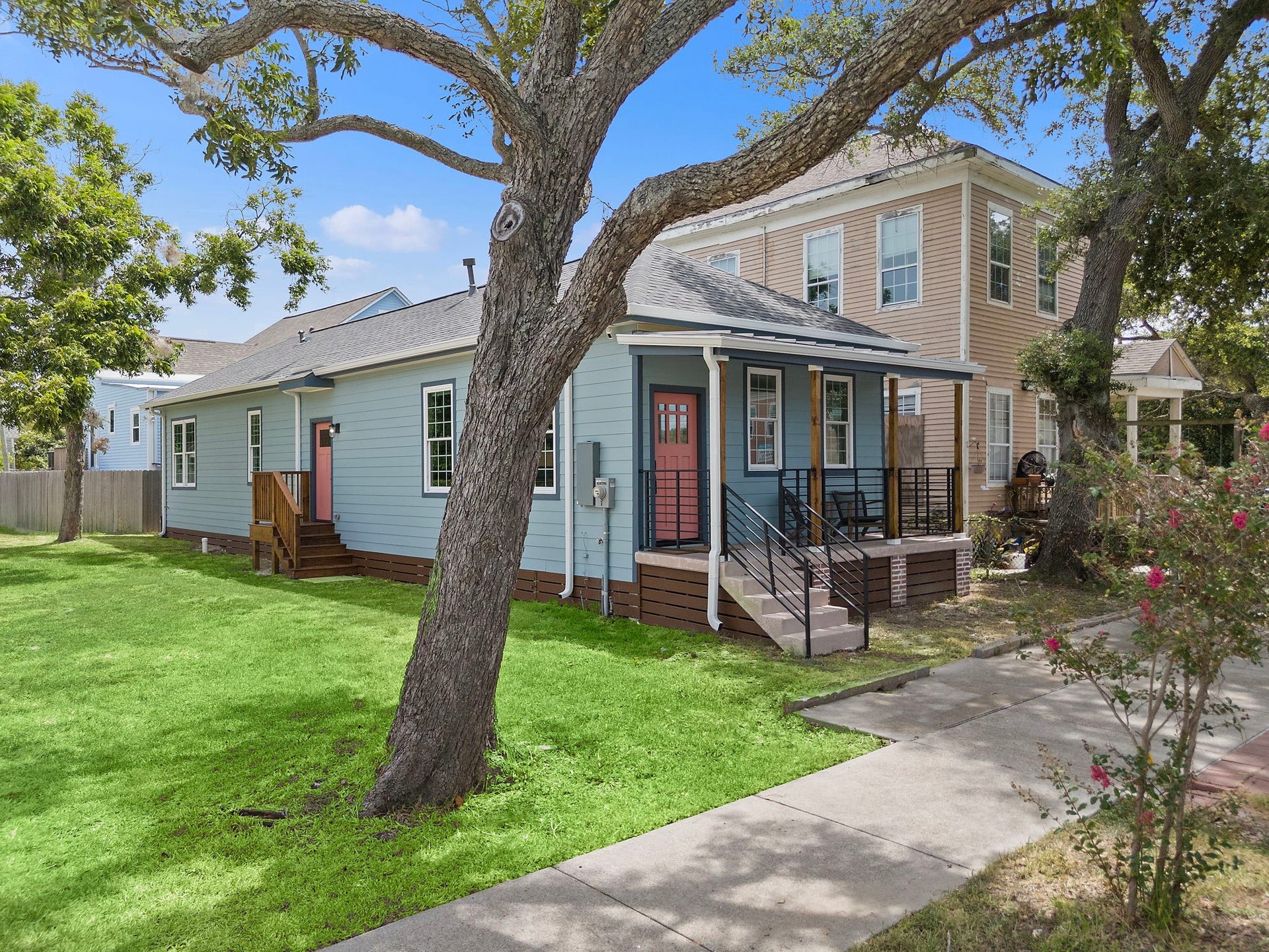 1825 Avenue N Street, Galveston, TX 77550 Side view of home - new fence, walkway, and pathed front lawn has been installed since this picture.
