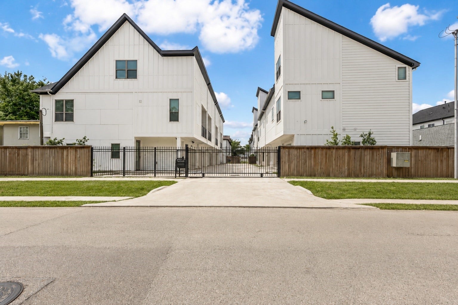 Gated community access adds an extra layer of privacy while complementing the clean, contemporary architecture. Modern white faades, private drive access, and a well maintained setting create an impressive arrival home.