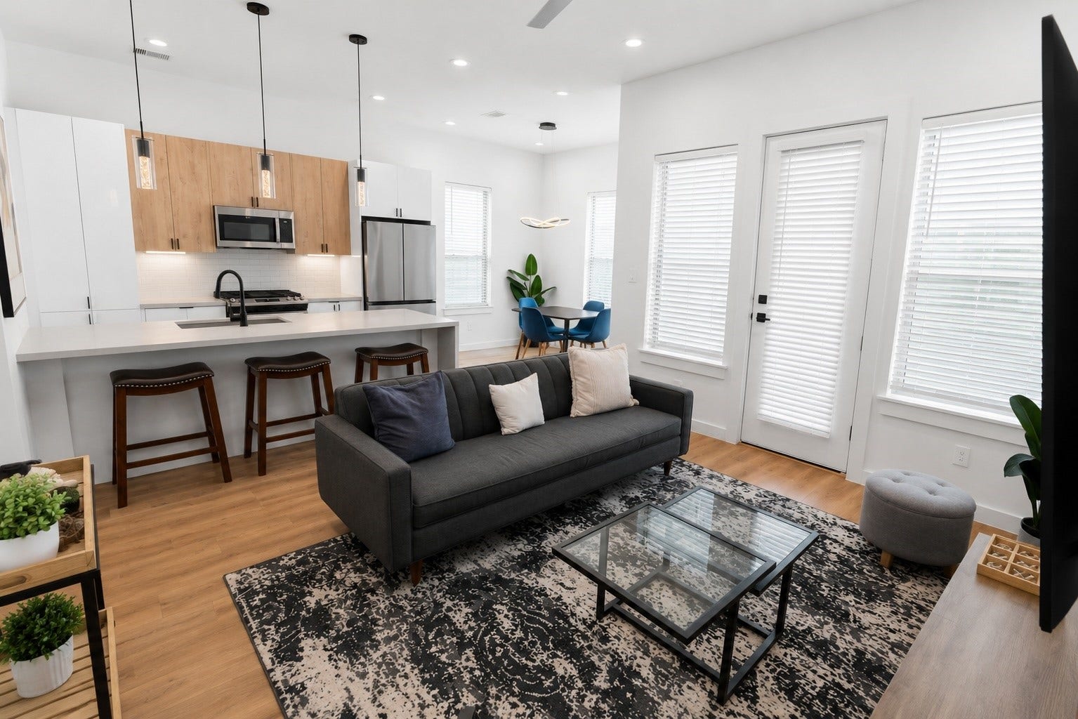 Open concept design brings the living room, kitchen, and dining area together in one bright, inviting space that is perfect for everyday living and entertaining. Large windows fill the home with natural light while the balcony access extends the living space outdoors for morning coffee or evening relaxation.