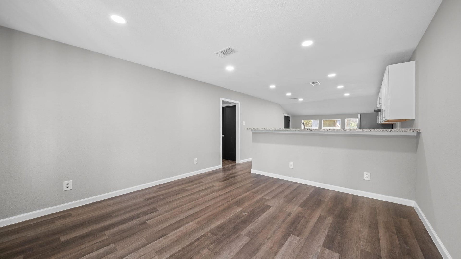 5242 Greylog Drive, Houston, TX 77048 The open-concept living space showcases sleek modern lines and a sophisticated neutral palette, creating a bright, airy atmosphere with timeless appeal and endless possibilities for personal expression.