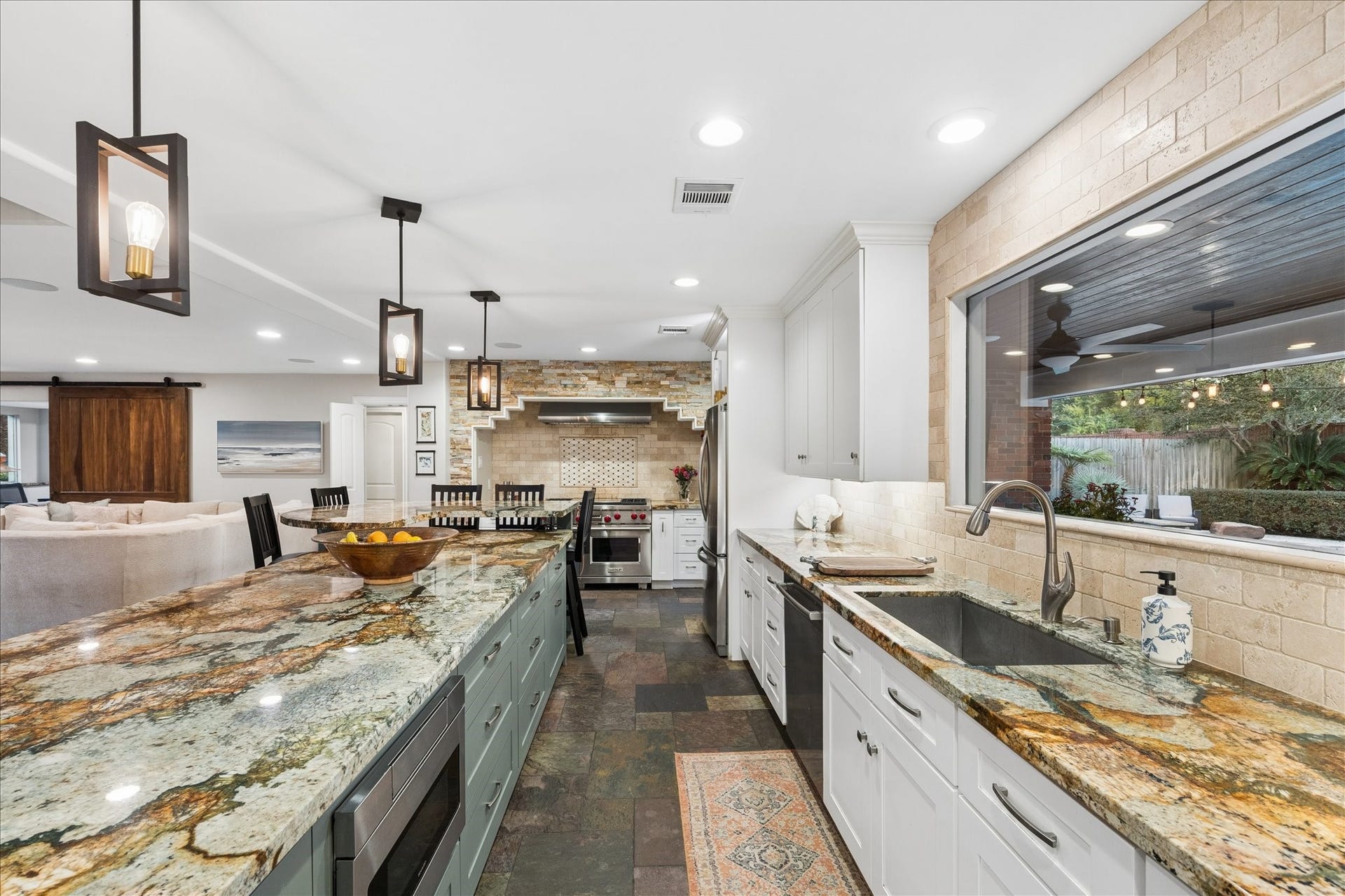 13723 Taylorcrest Road, Houston, TX 77079 Natural light abounds throughout, the kitchen has views to the resort styled backyard.