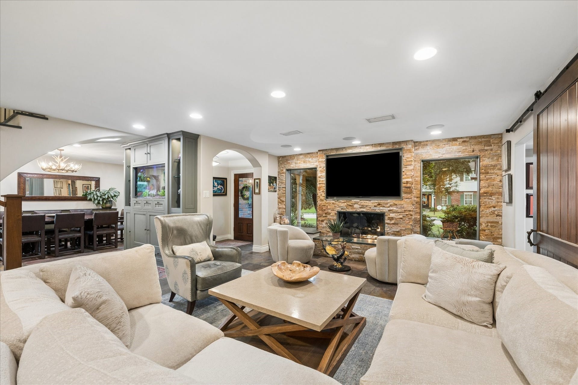 13723 Taylorcrest Road, Houston, TX 77079 Great room with stone fireplace, loads of natural light and sight lines throughout the entertaining areas
