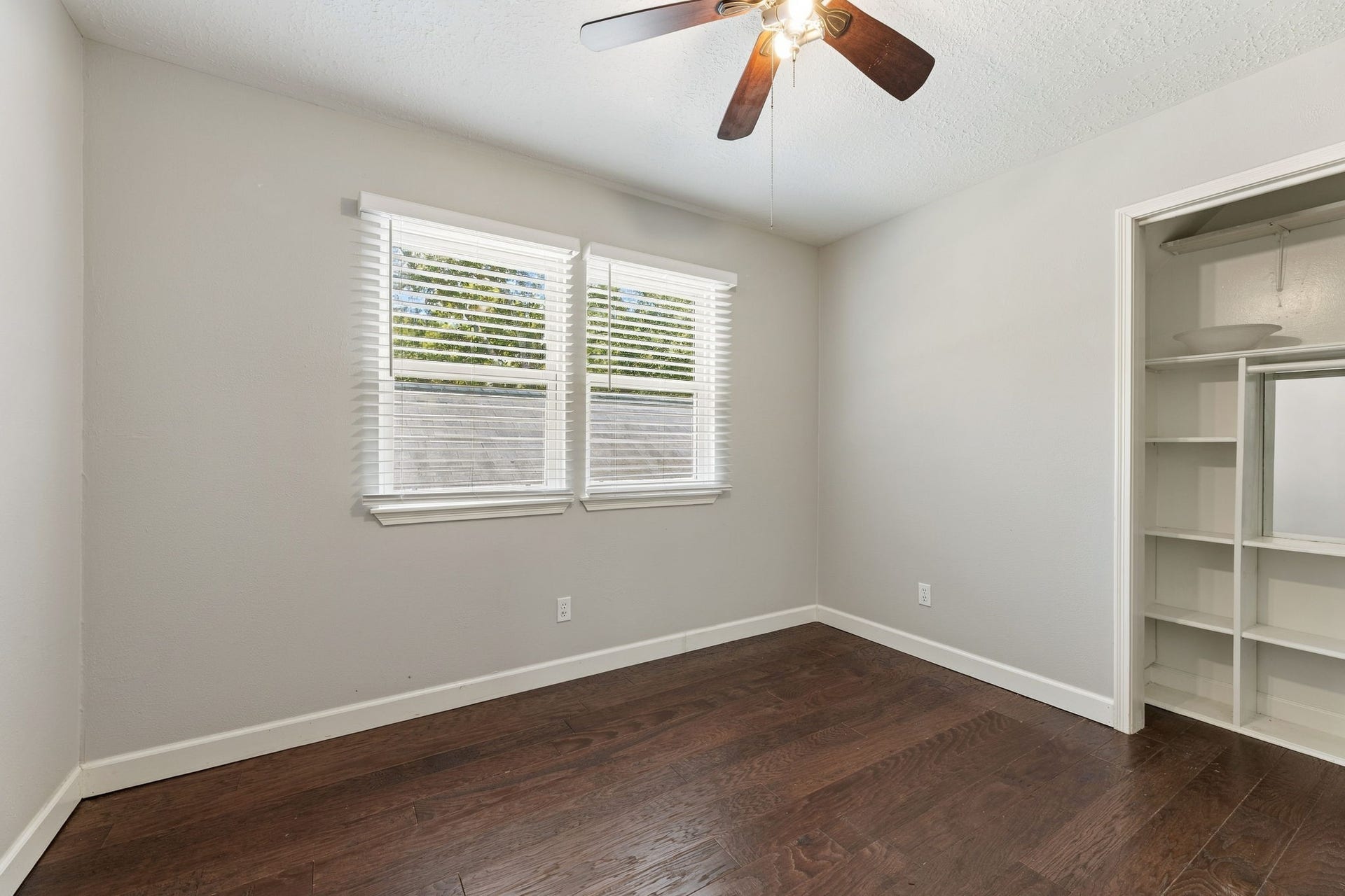 4411 Deerfield Village Drive, Houston, TX 77084 Bright secondary bedroom with ceiling fan and ample space!