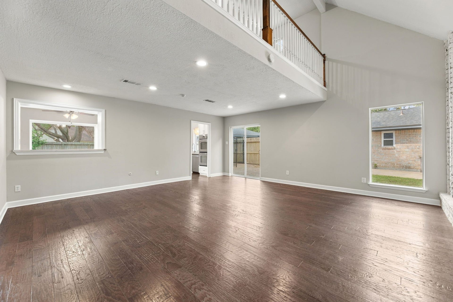 4411 Deerfield Village Drive, Houston, TX 77084 Spacious living area with soaring two-story ceilings!