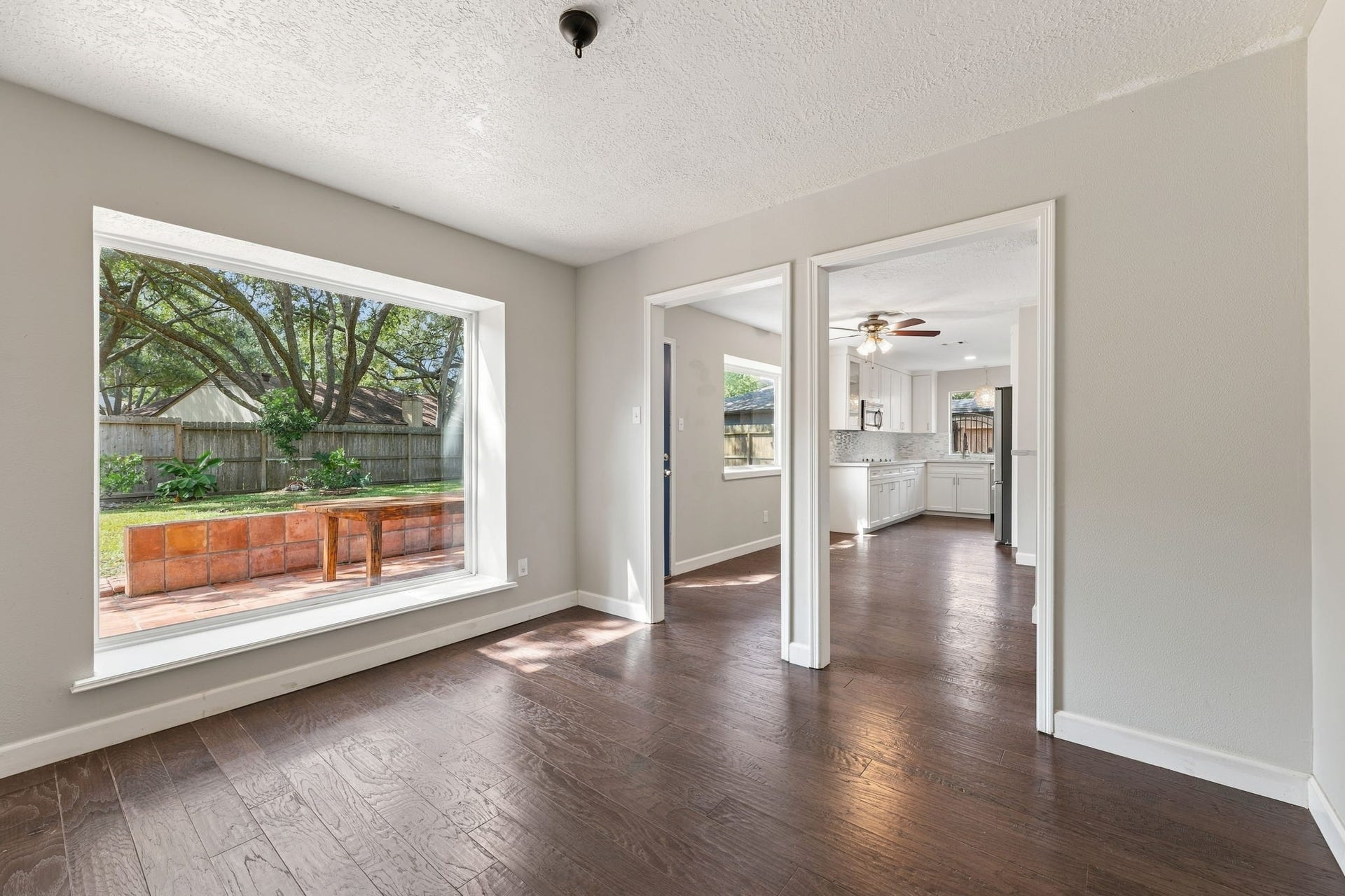 4411 Deerfield Village Drive, Houston, TX 77084 Versatile dining space with classic wall detailing and backyard views!