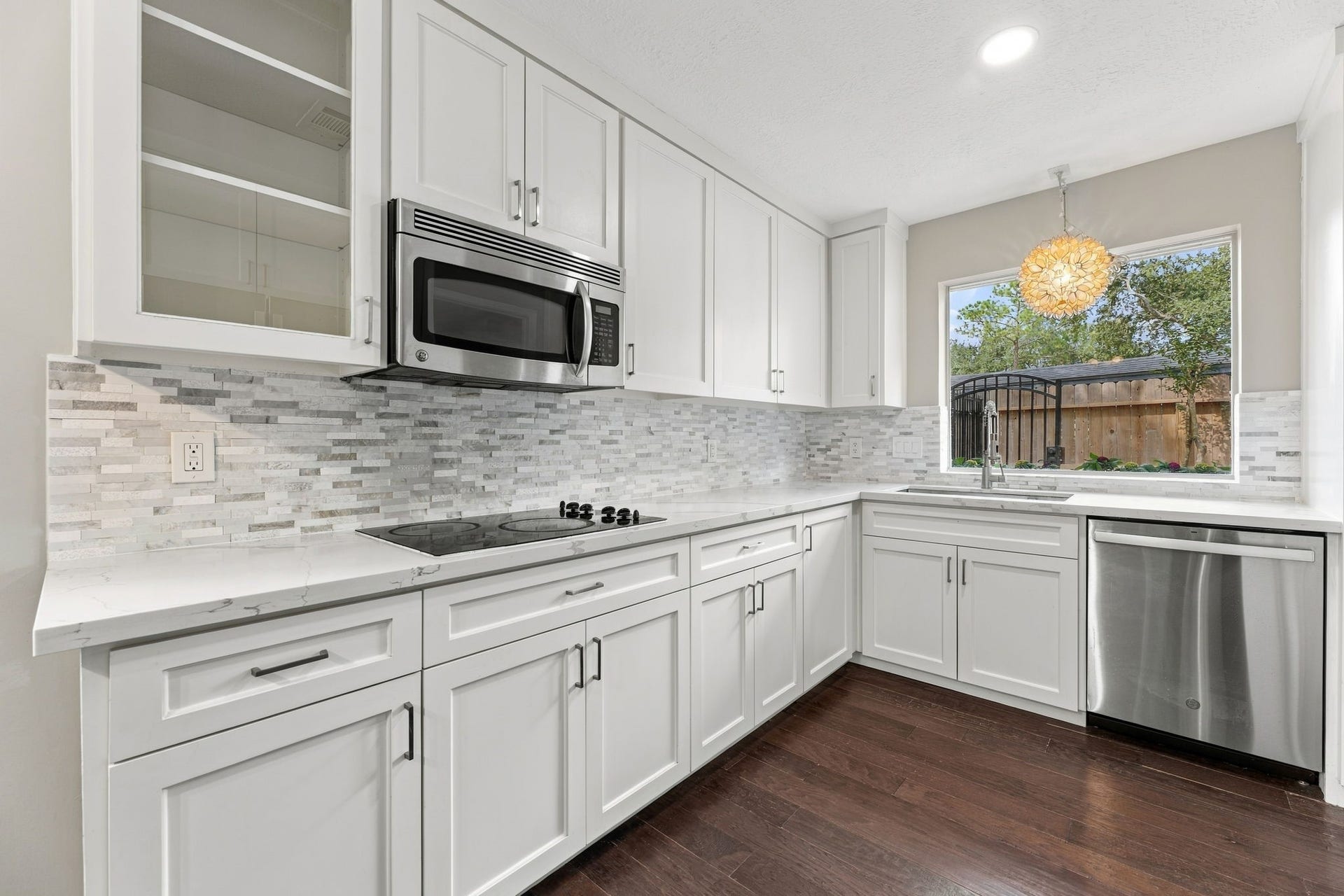 4411 Deerfield Village Drive, Houston, TX 77084 Bright kitchen with shaker-style cabinetry and quartz countertops!