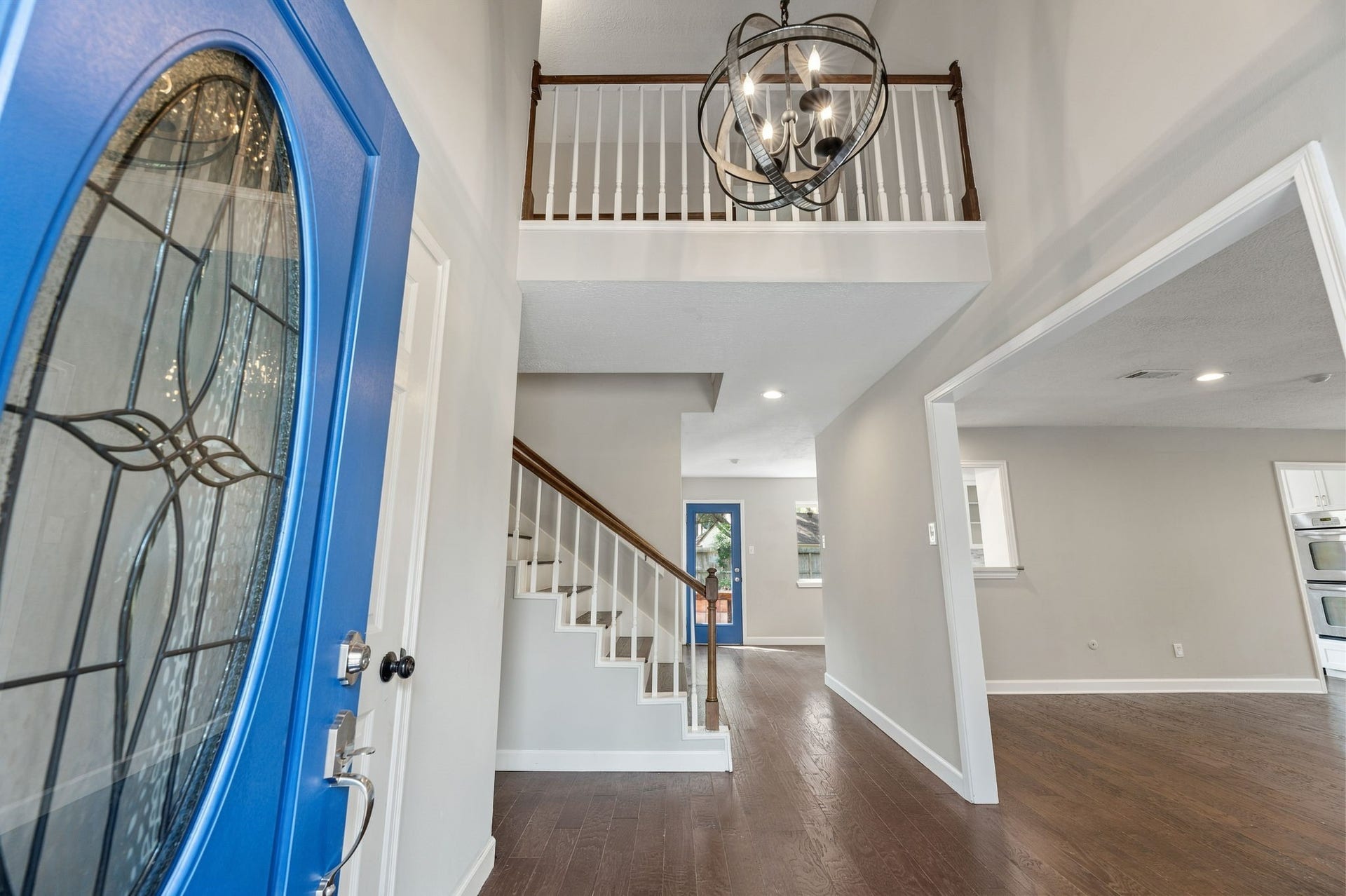 4411 Deerfield Village Drive, Houston, TX 77084 Enter and be greeted by charming chandelier and upstairs balcony!